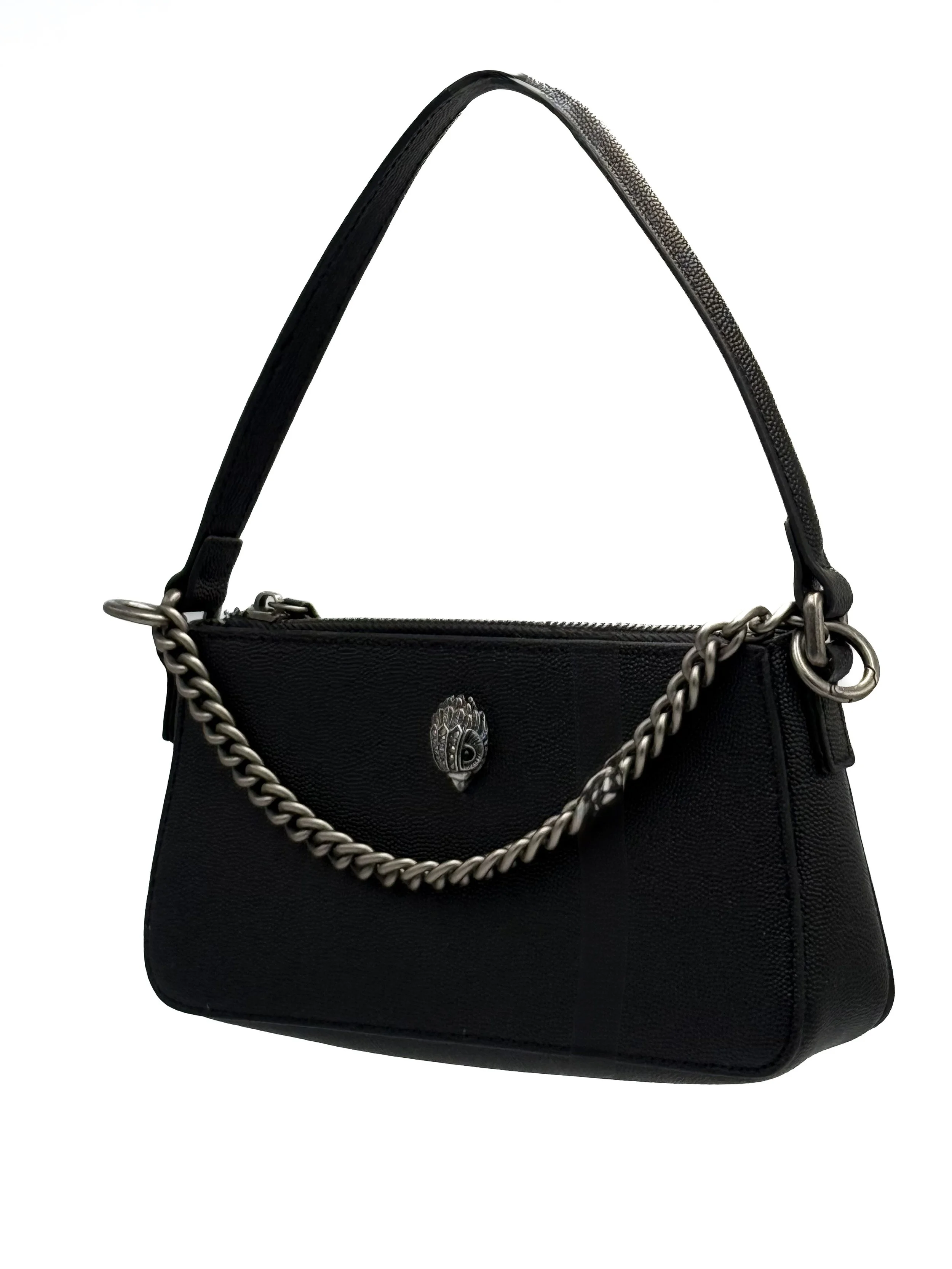 Black handbag with silver chain and decorative emblem in the center