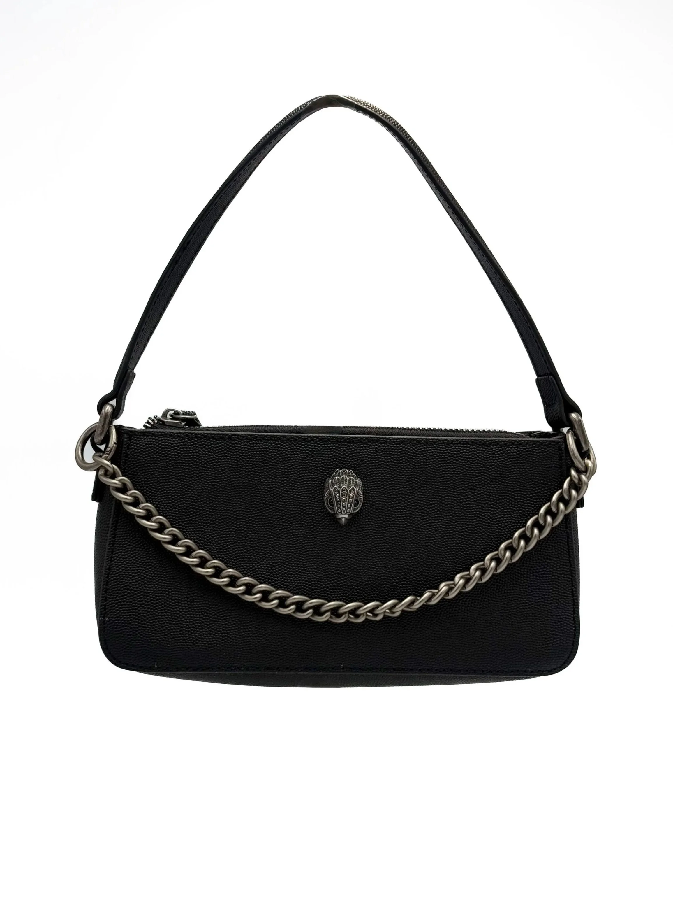 Black handbag with a thick silver chain and metallic emblem on the front