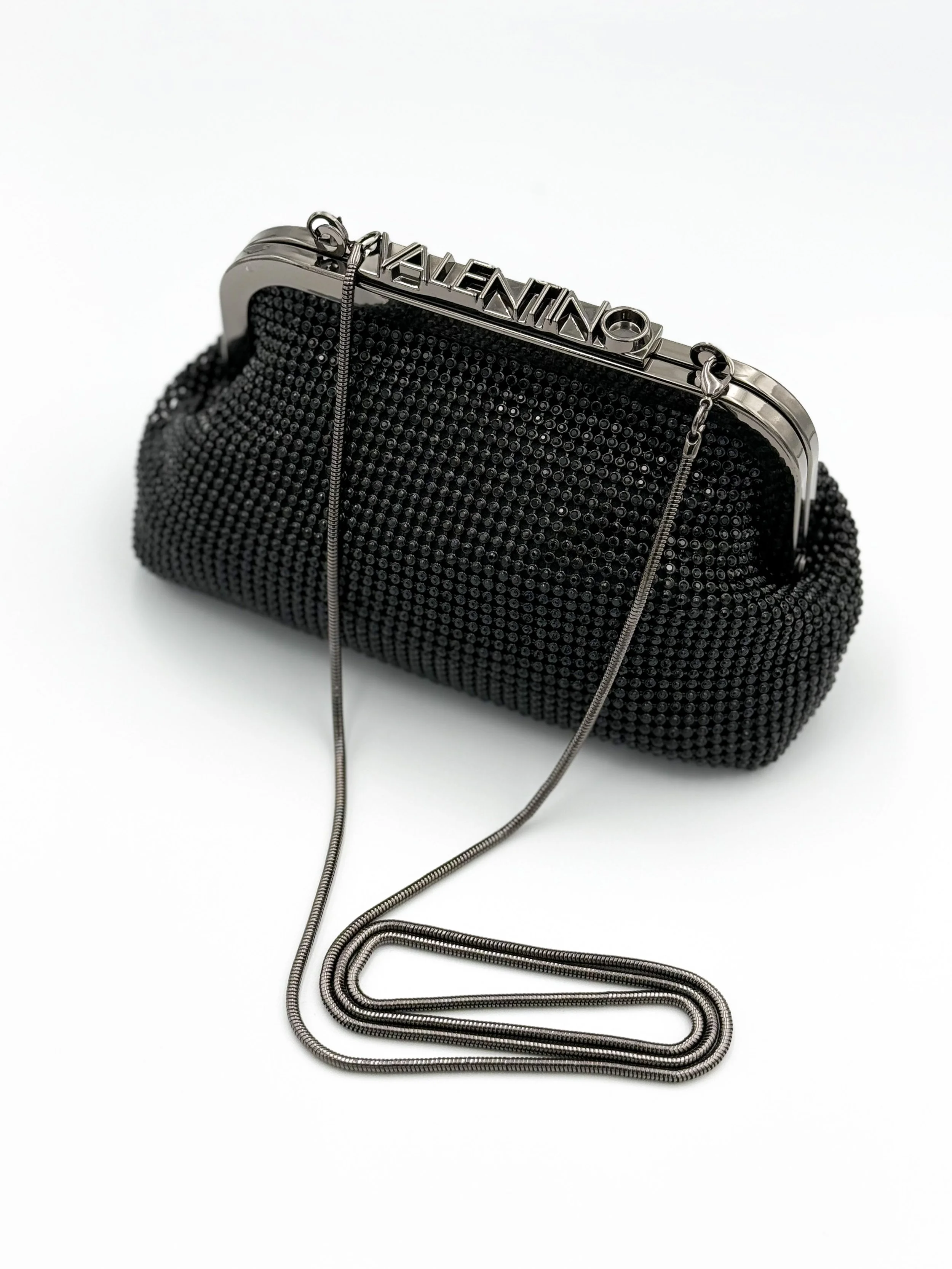 Black beaded evening clutch purse with silver metal frame and chain handle, with 'Valentino' engraved on the top.