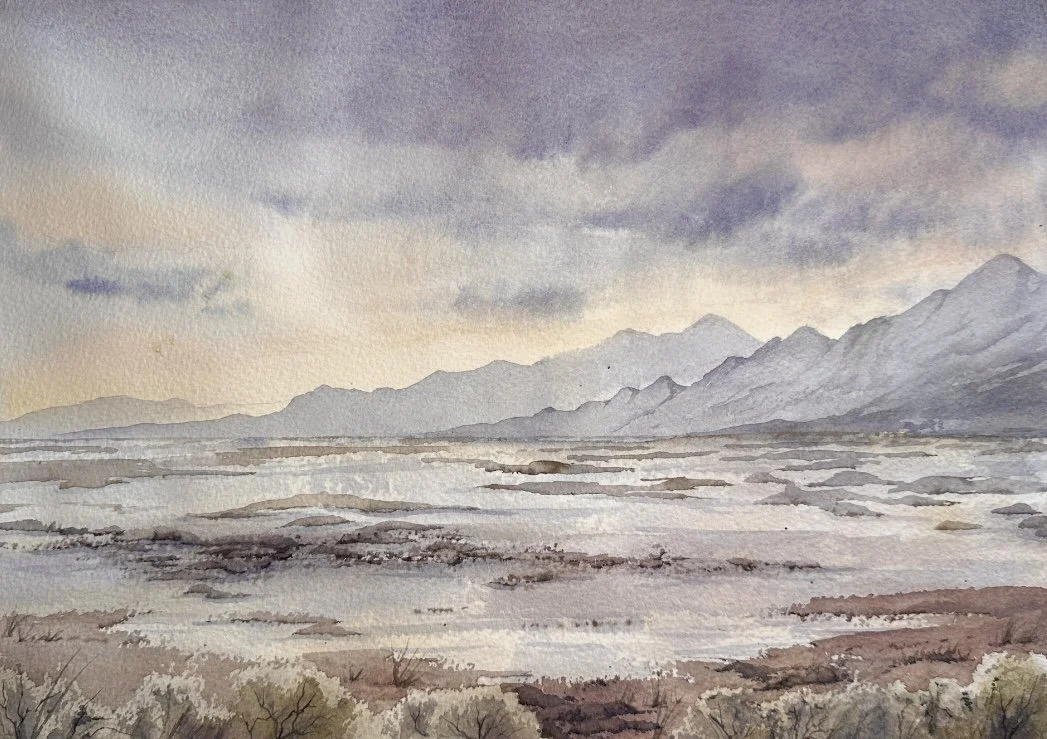 Watercolor painting of a vast landscape with mountains in the distance, a flat plain, and a cloudy sky.