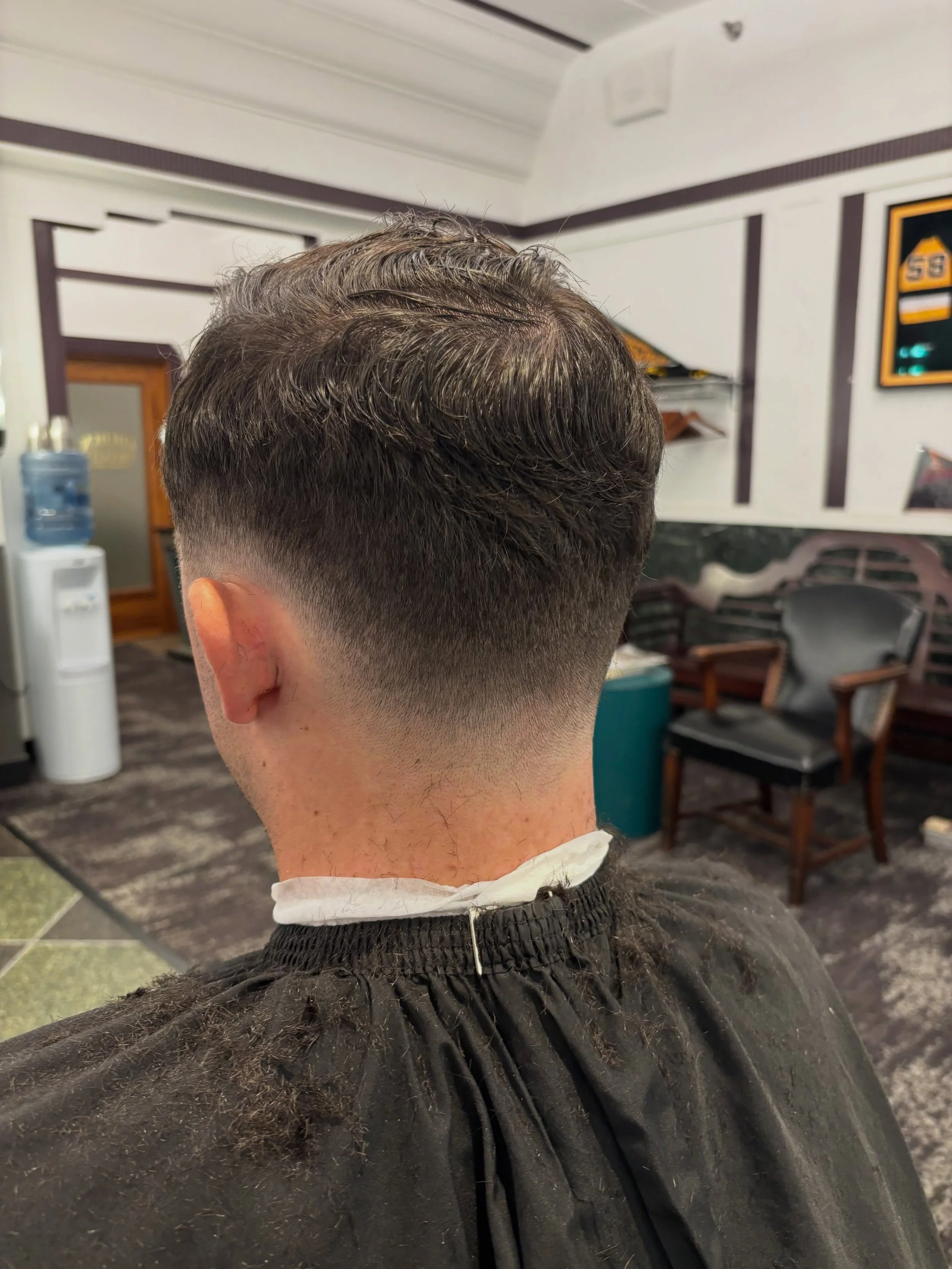 Detailed low fade haircut at Golden Triangle Barber Shop
