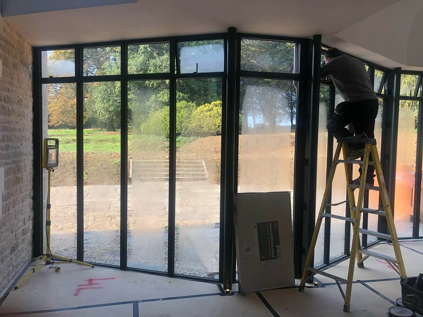 ✨ Design meets daylight.

This space features full-height windows paired with a central roof light, creating a seamless connection between indoors and out. Every detail is engineered to maximise natural light and elevate modern living.

#interiordesi