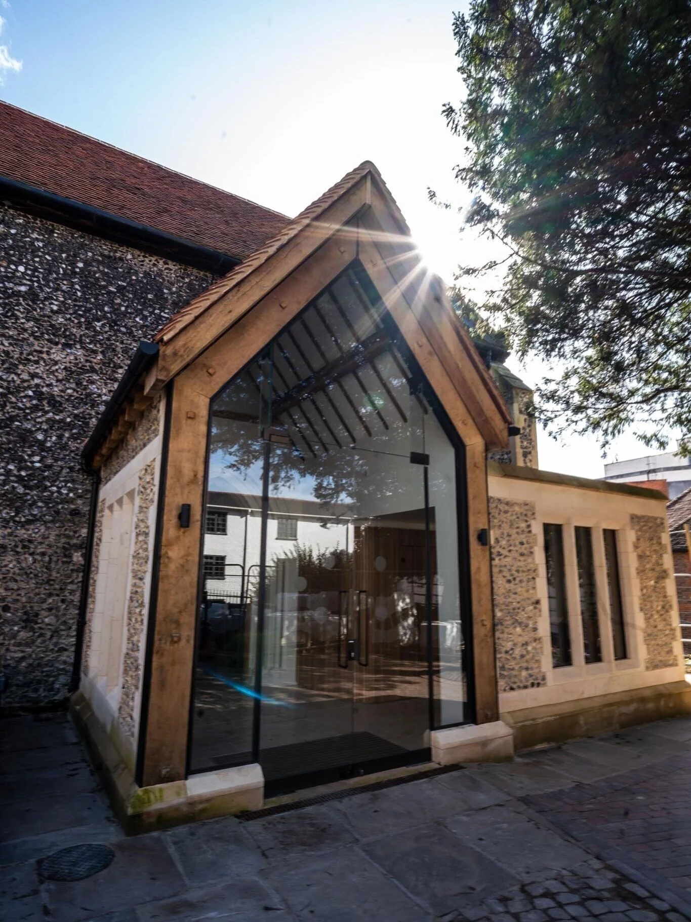 ⛪✨ Tradition meets transparency.

This glass entrance breathes new life into a historic church, creating a light-filled welcome while preserving the building&rsquo;s character. A modern solution that respects heritage, adds accessibility, and invites