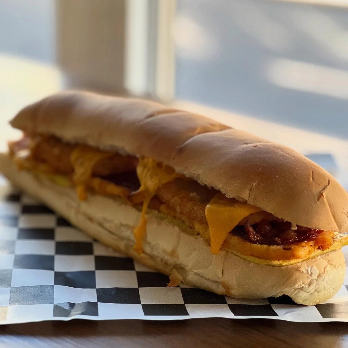 The sandwich your hangover has been praying for. The Wake n&rsquo; Bacon🥓🍳 egg, thick cut bacon, peameal bacon, crispy hash browns, cheddar. Available this Saturday &amp; Sunday.
