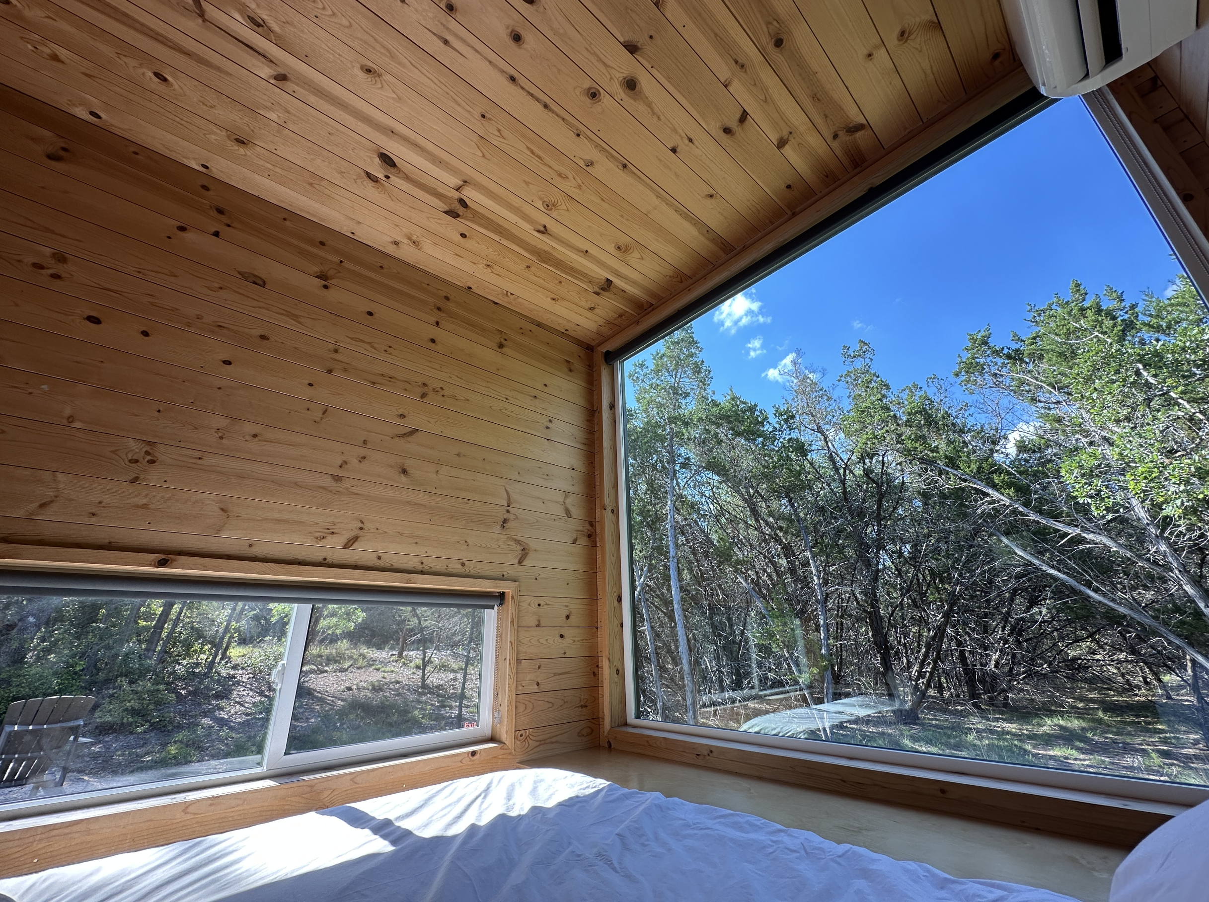 Large picture window and trees outside