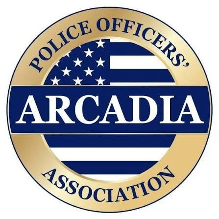 Logo for the Arcadia Police Officers Association with a gold and blue color scheme, featuring a stylized American flag and text.