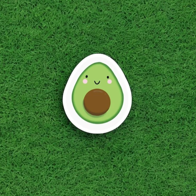 Cartoon illustration of an avocado with a smiling face on a green grass background.