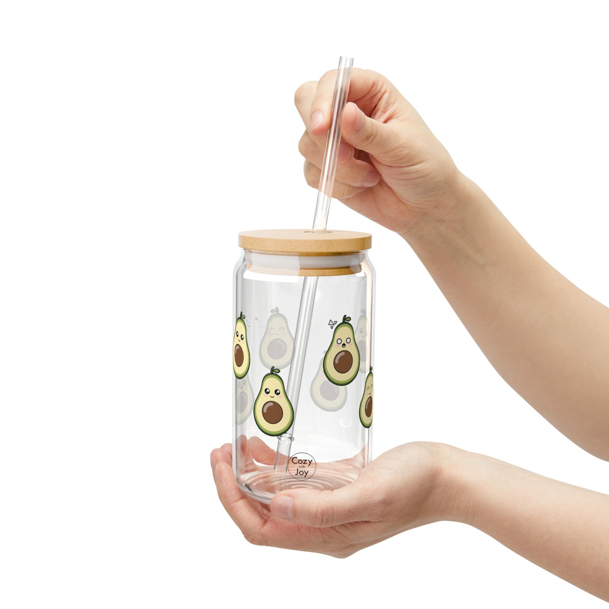 Kawaii avocado glass tumbler with a bamboo lid and straw, featuring a cute avocado blowing a kiss.