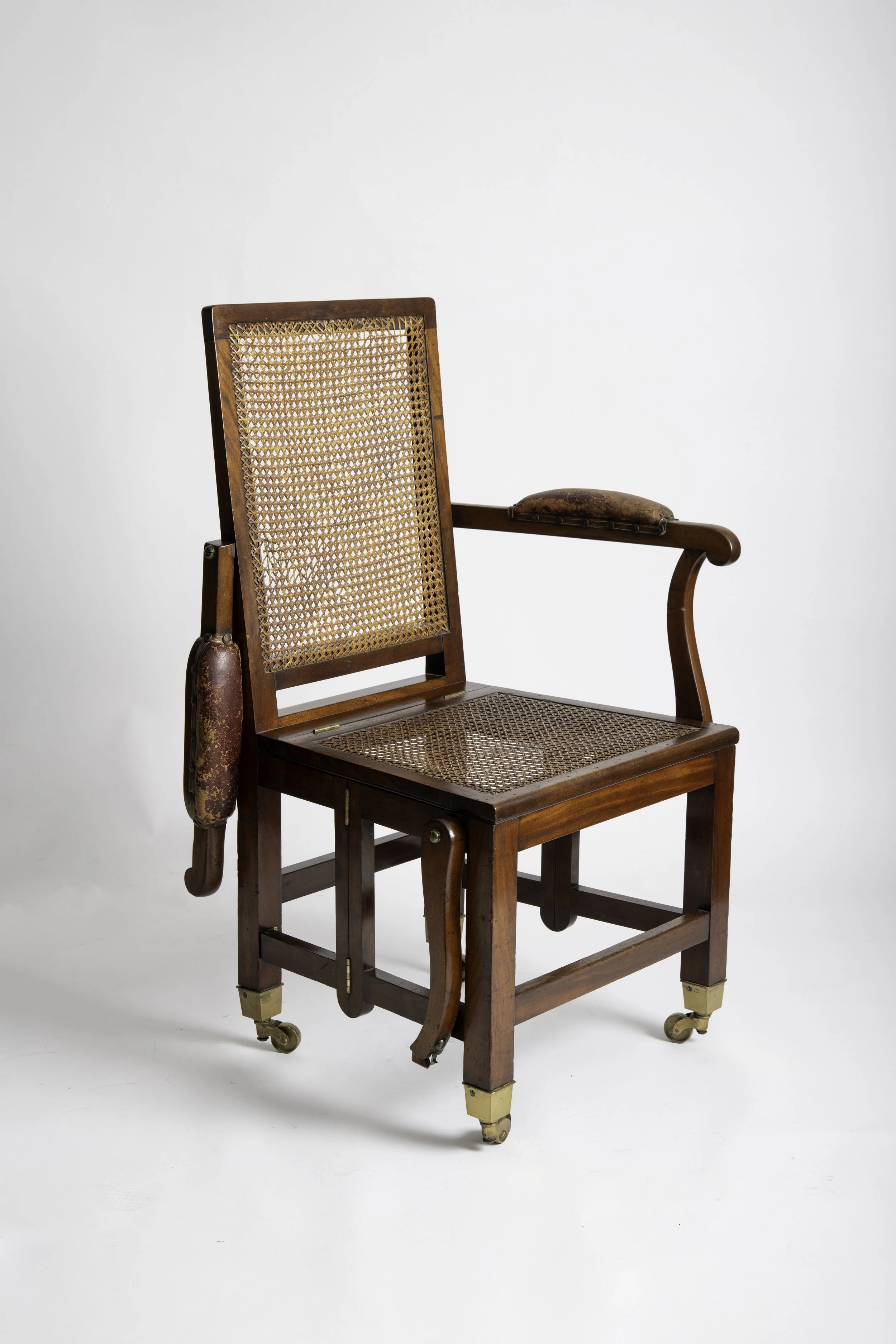Johnstone & Jeanes campaign chair showing the released arm and folding mechanism