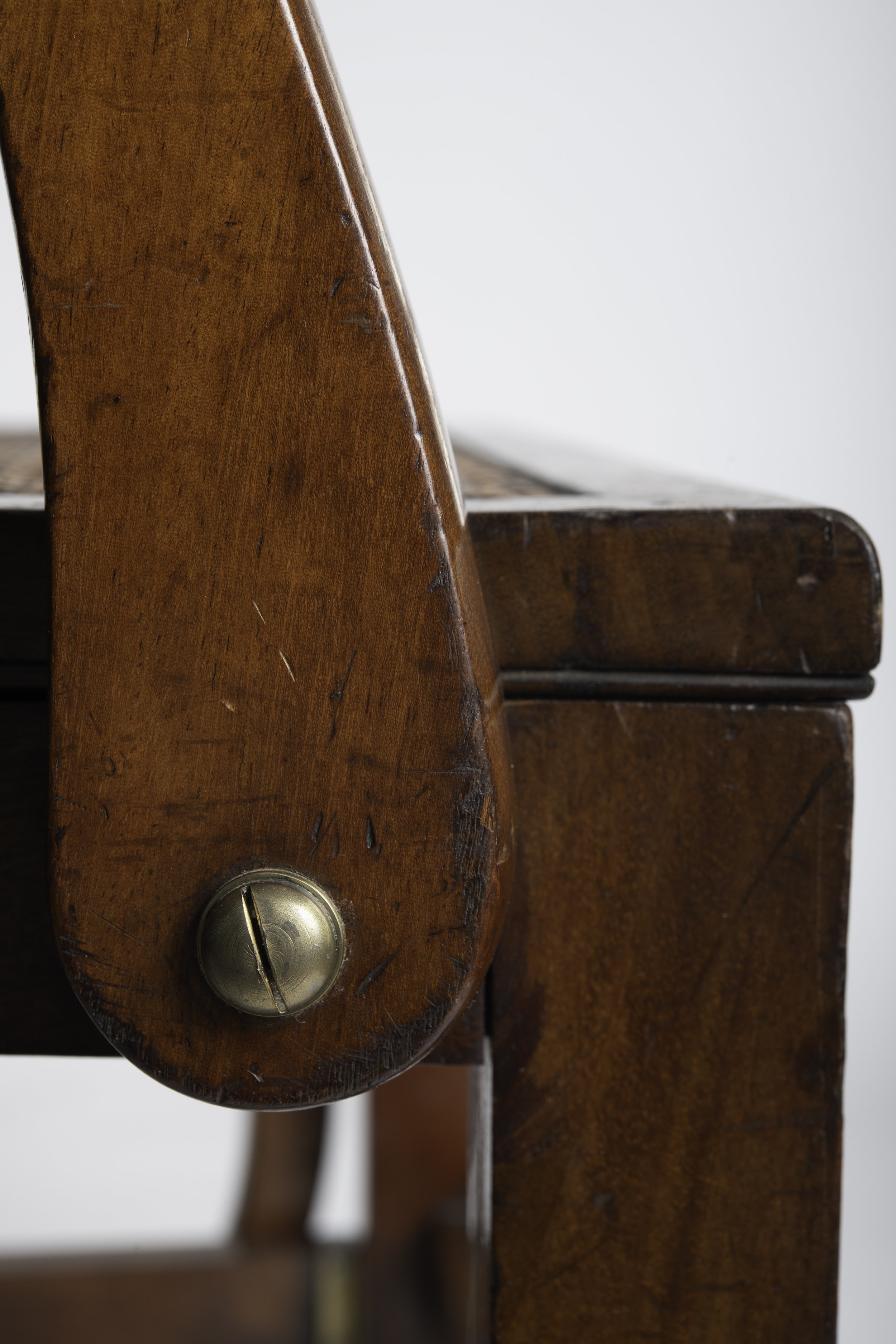 Brass arm pivot and surface scarring caused by the mechanical action
