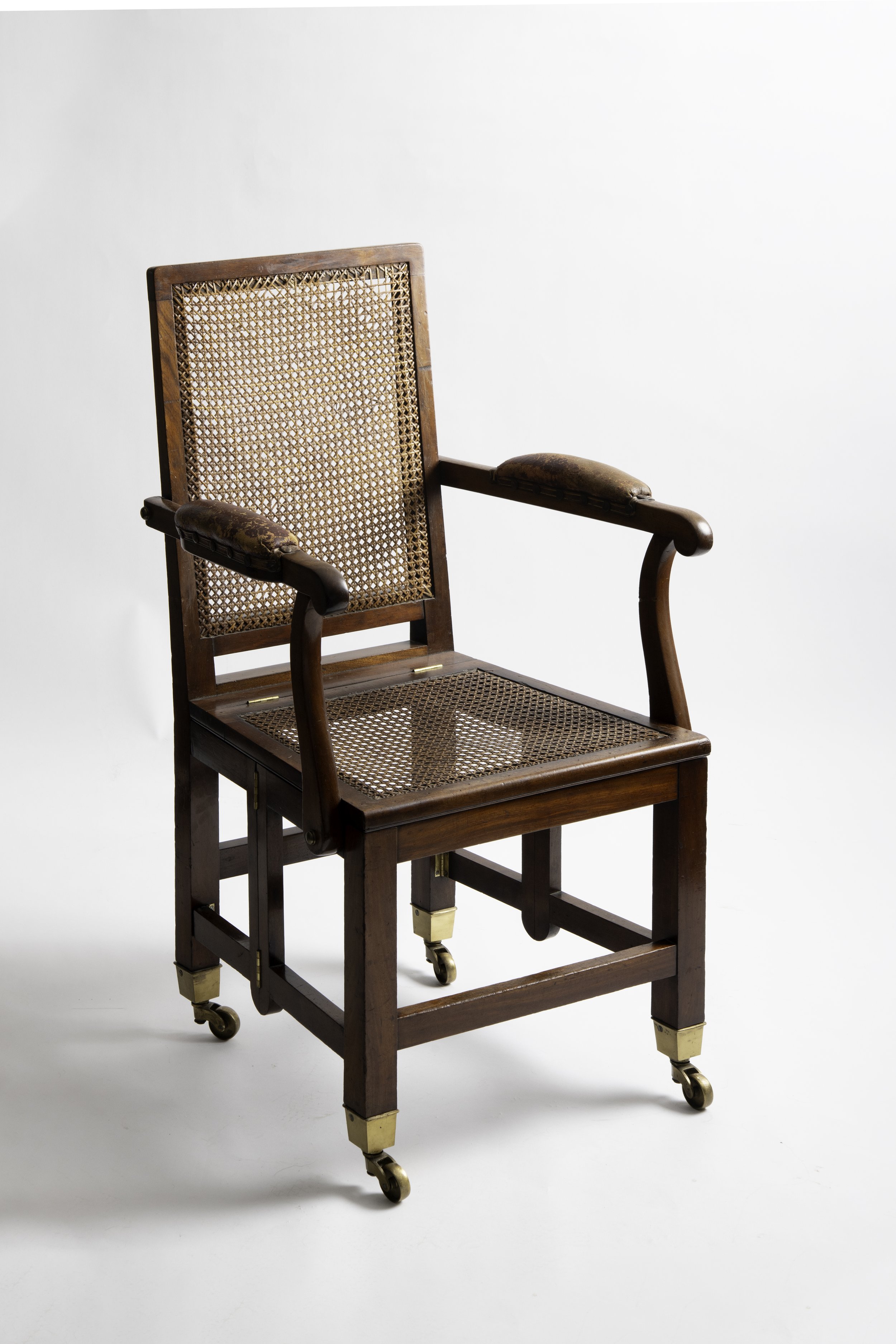 Johnstone & Jeanes campaign armchair with caned seat and back, opposite three-quarter view