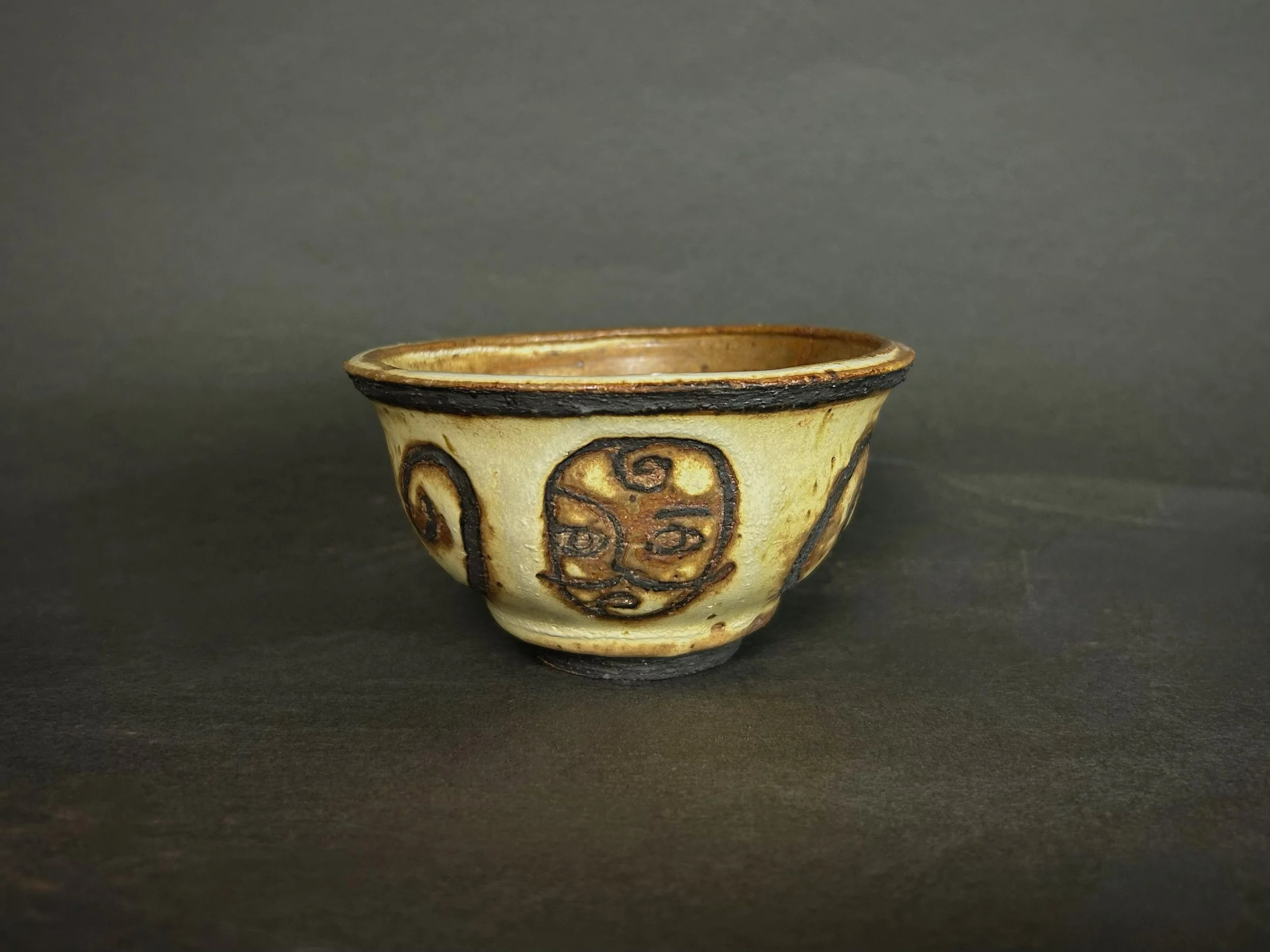 'Swirl about it' teacup - Yellow salt high fire glaze, black slip