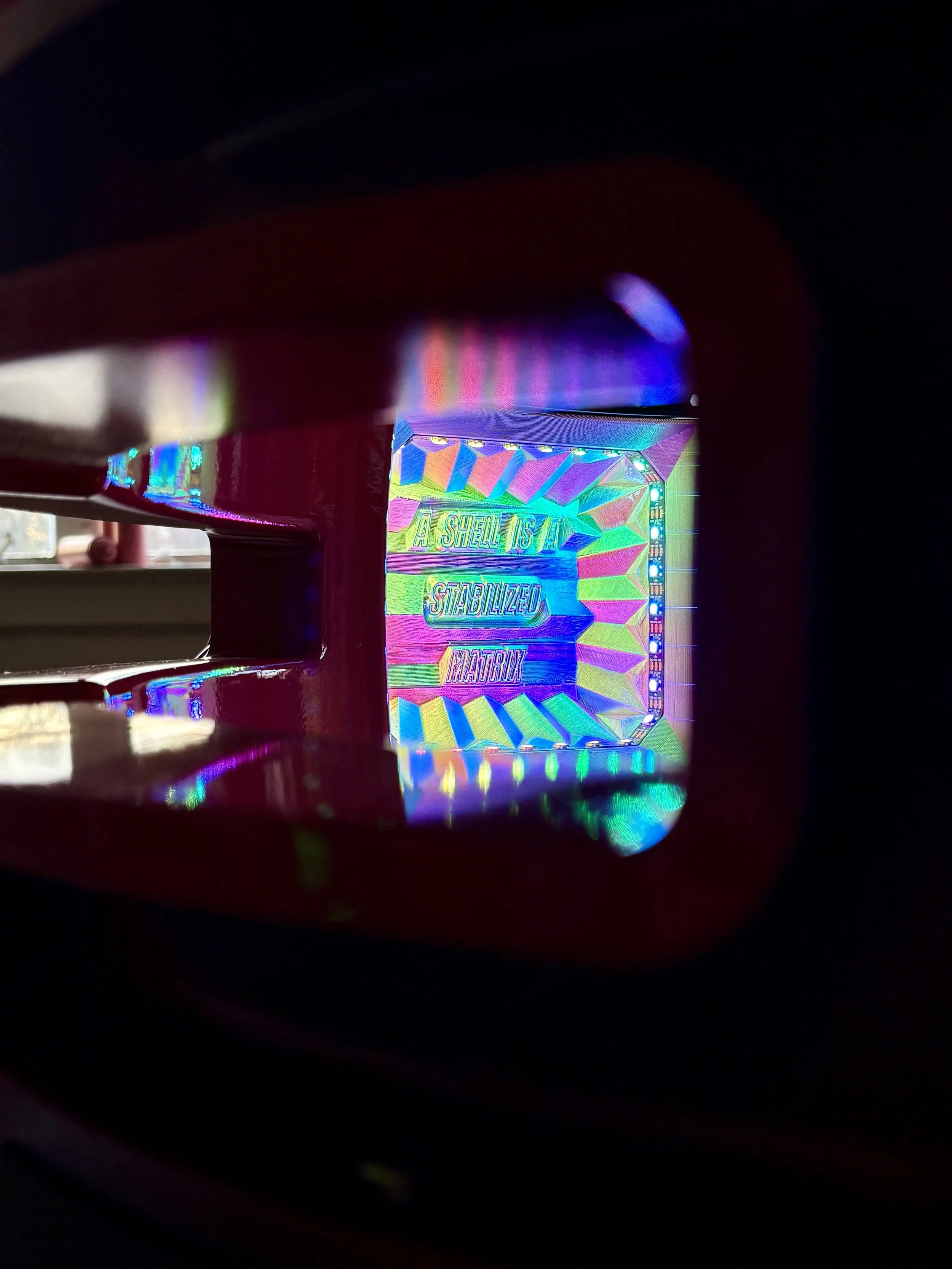 The inverted shape asks viewers to observe from multiple angles to see the full interior.