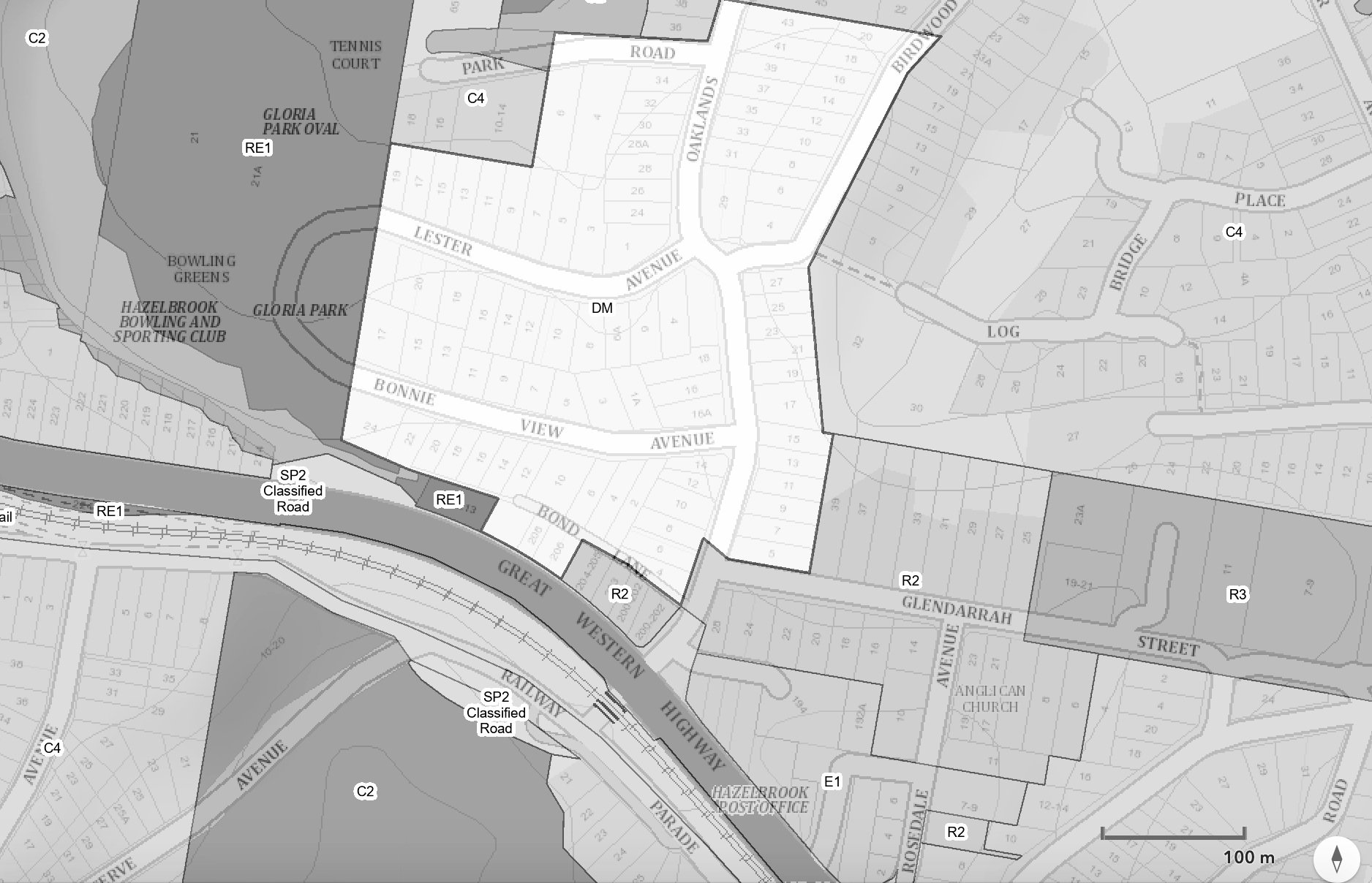 A grayscale map showing street layouts, parks, residential areas, and landmarks like Hazelbrook Post Office, Anglican Church, and Hazlebrook Bowling and Sporting Club, with labels indicating roads, parks, and zones.