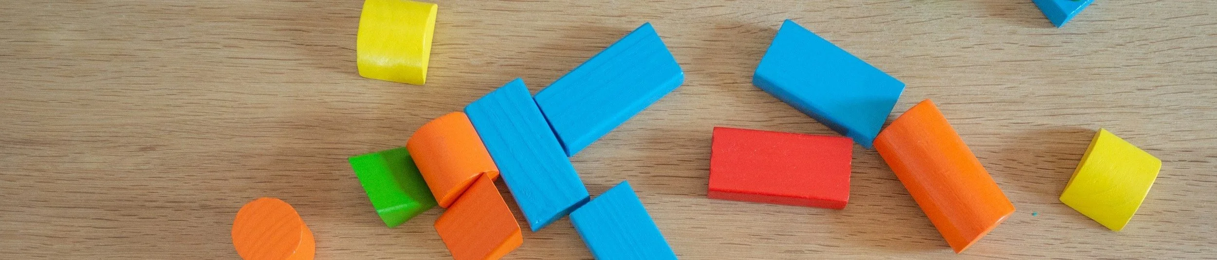 Closeup of colorful wooden blocks on a wooden table