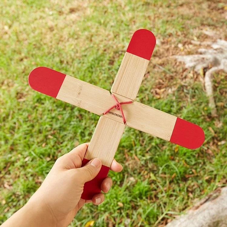 Closeup of a wooden X-shaped boomerang made from bamboo