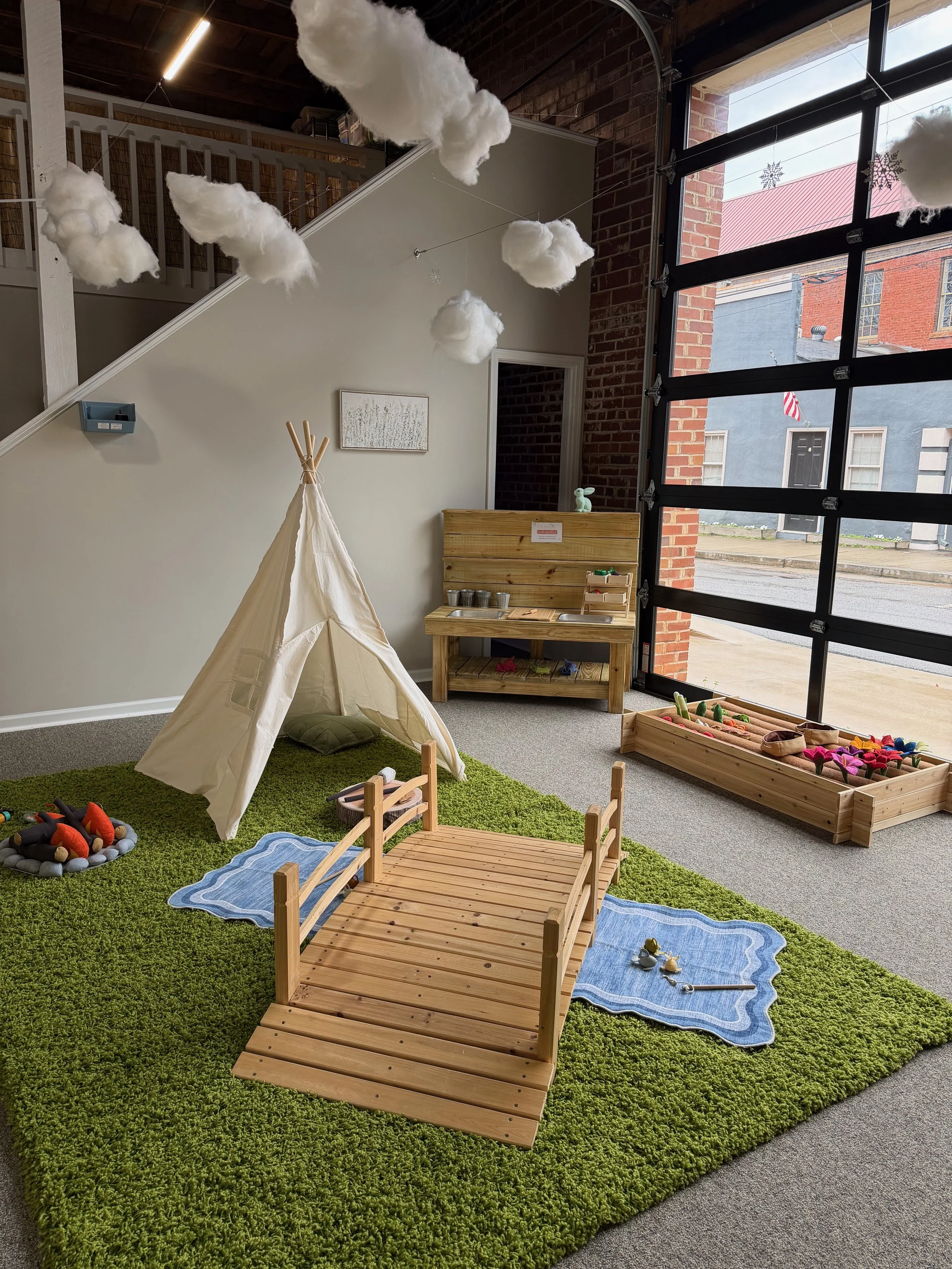 Main area of children's play studio with garden area