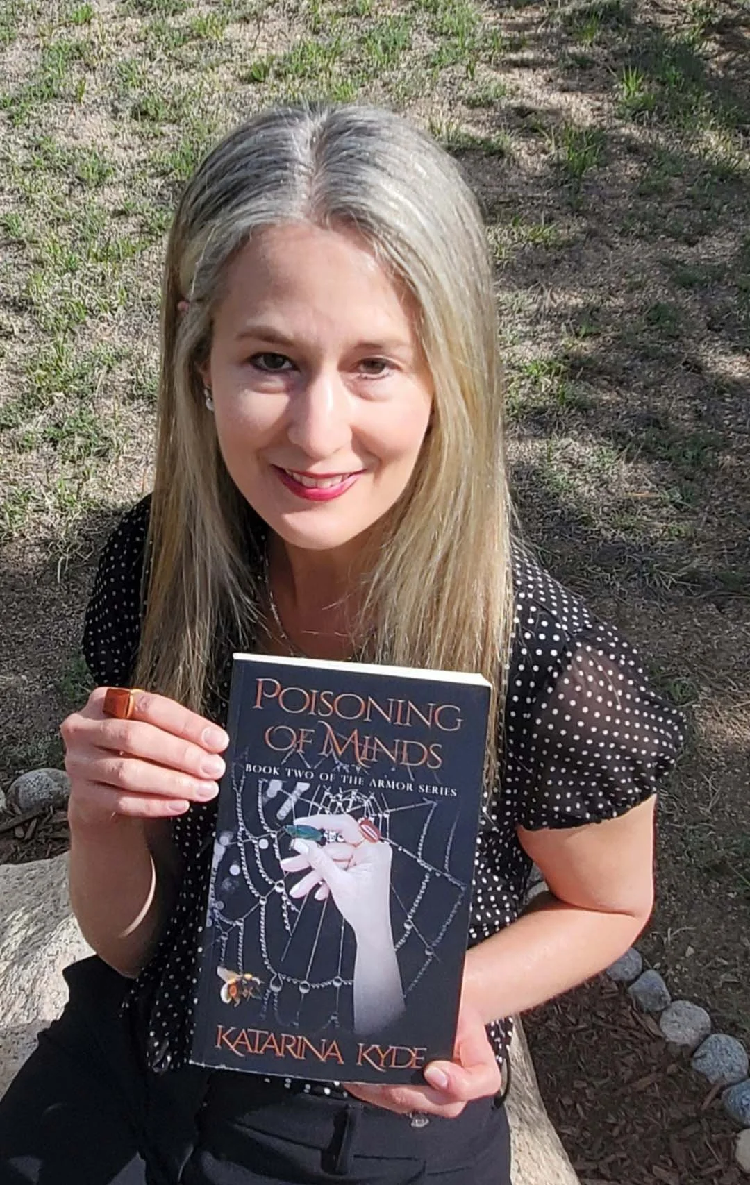 POM holding book.jpg