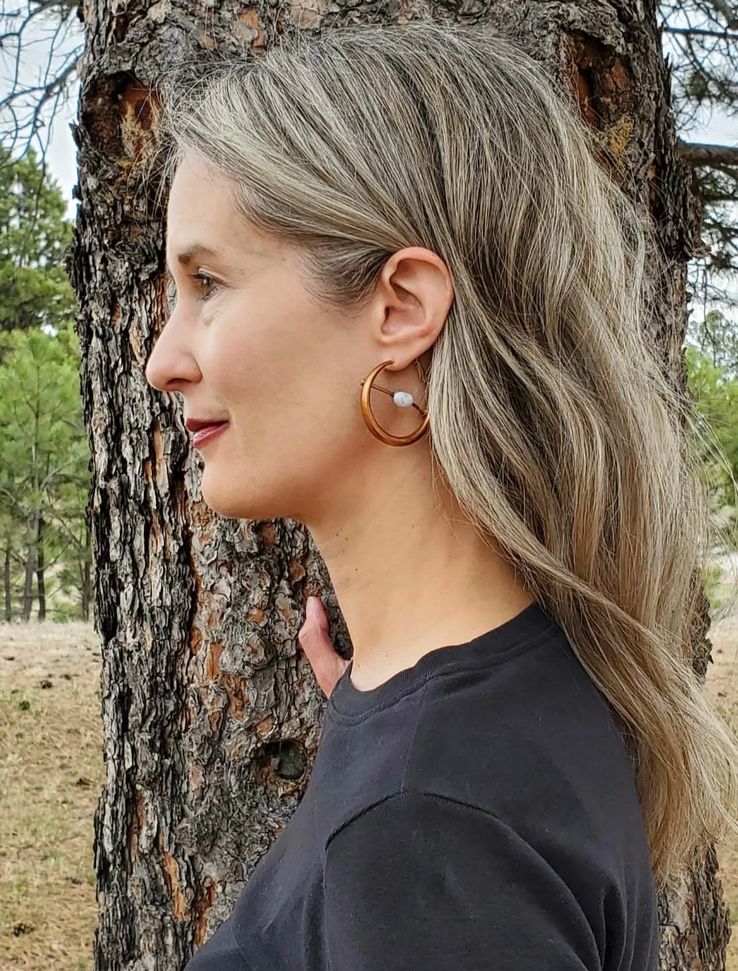 SOS me with earrings.jpg