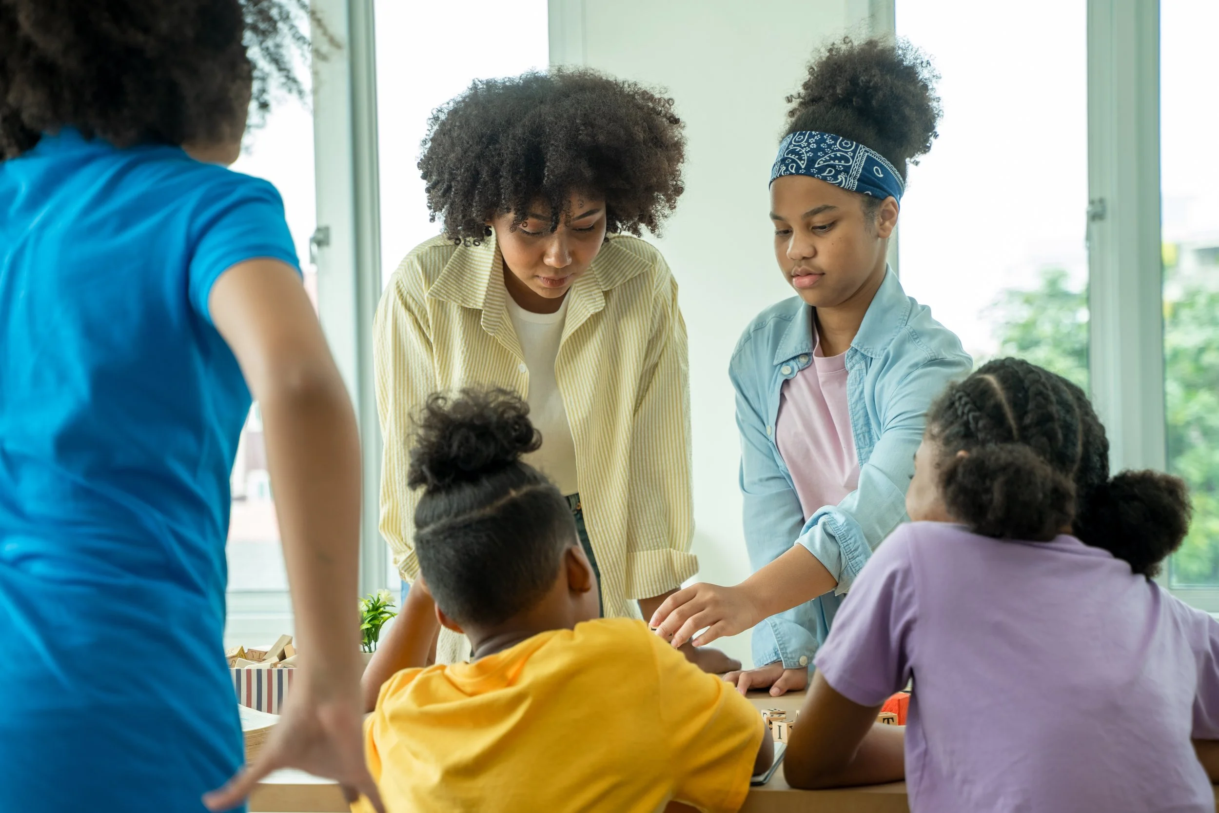 young-african-american-children-sitting-at-school-2023-11-27-04-51-07-utc.jpg