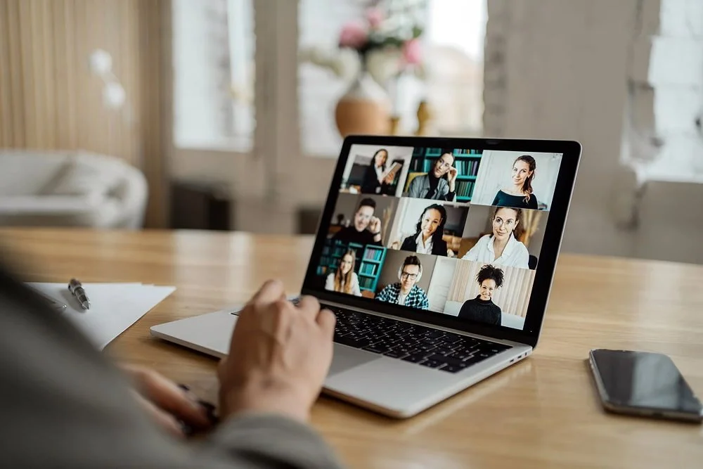 services-online-video-communication-with-colleagues-laptop-screen-office