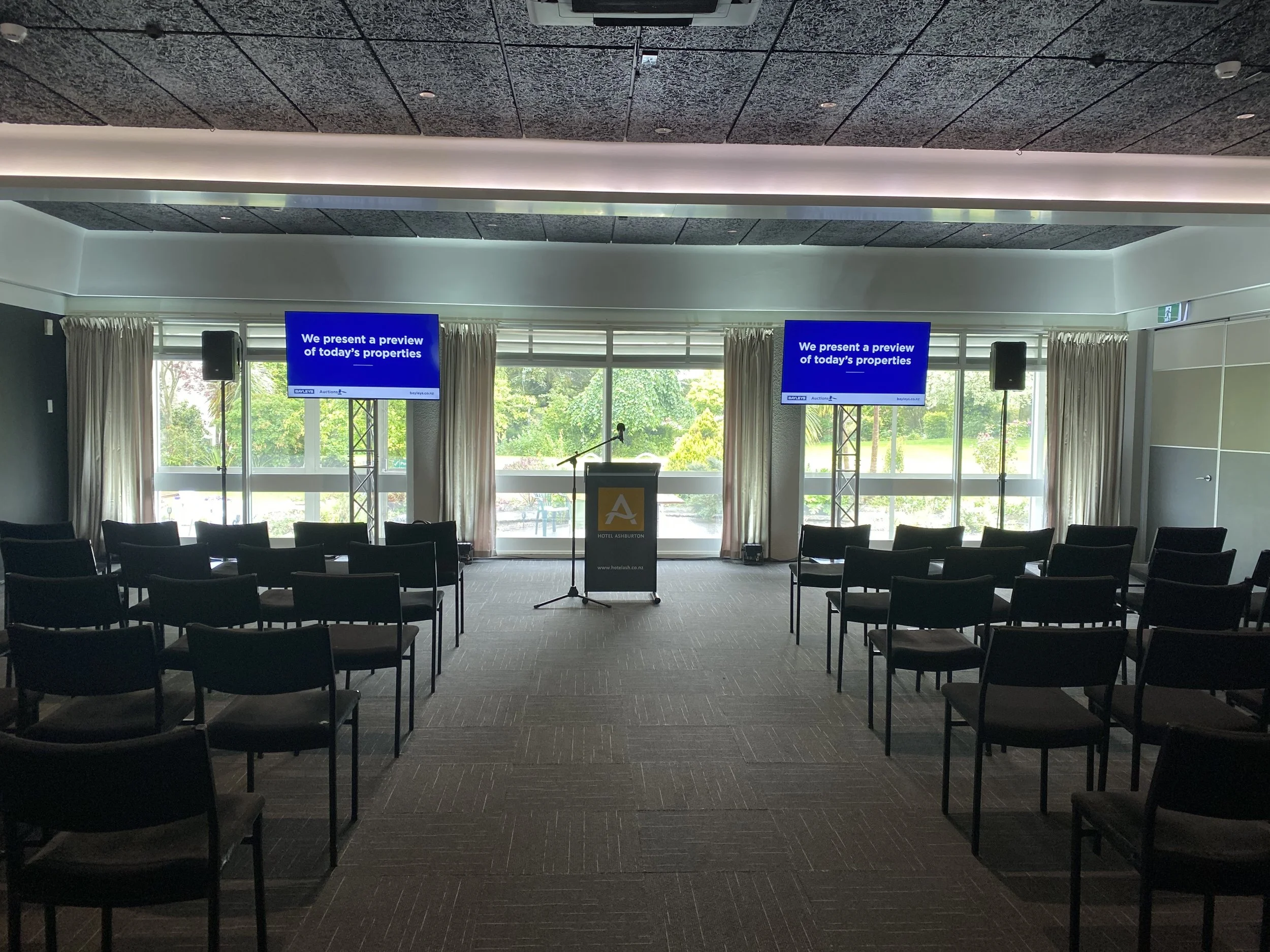 Corporate Event set up with linked TVs & a PA system at the Hotel Ashburton