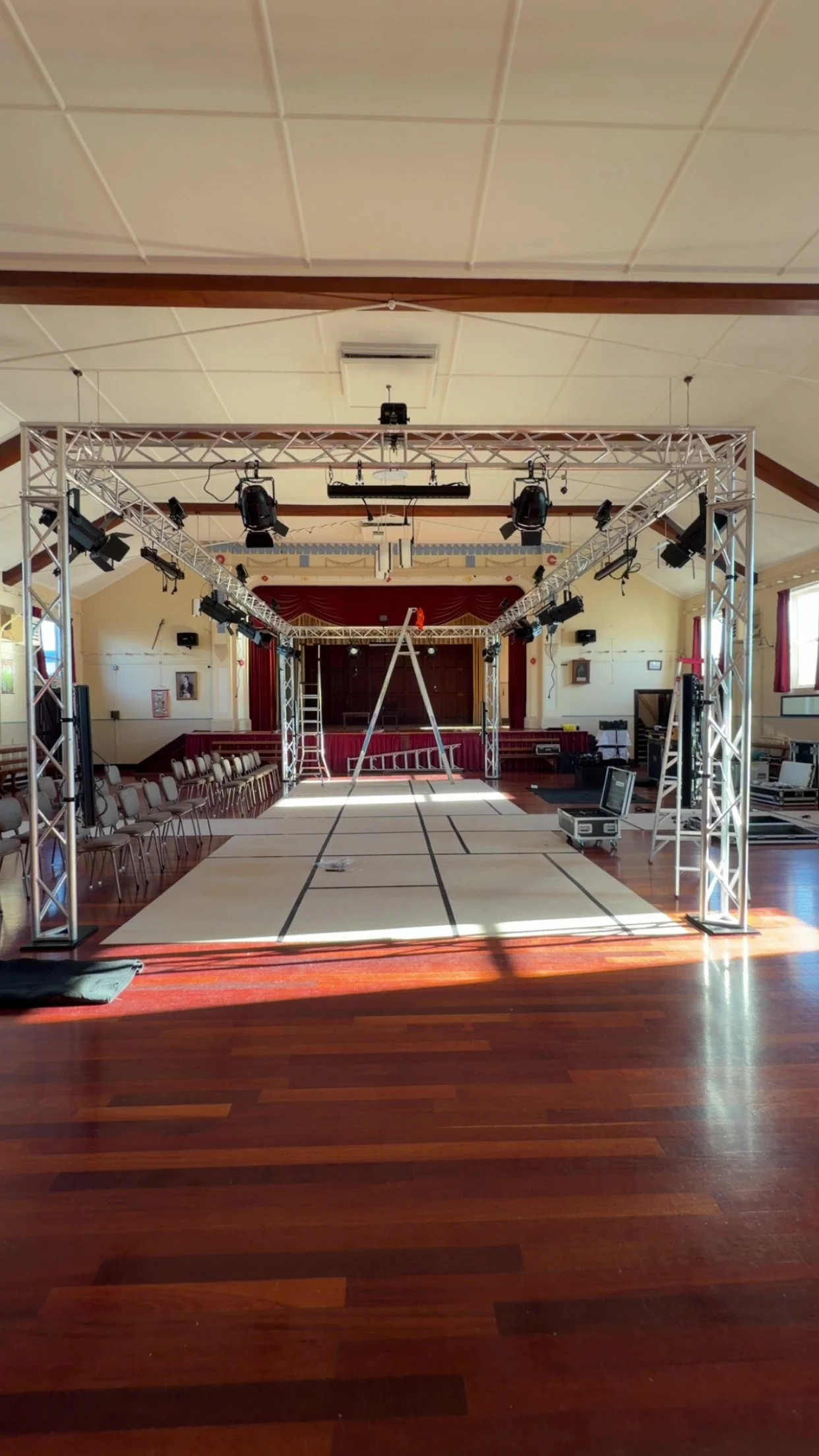 Truss structure set up in a hall. lighting and sound rigged 