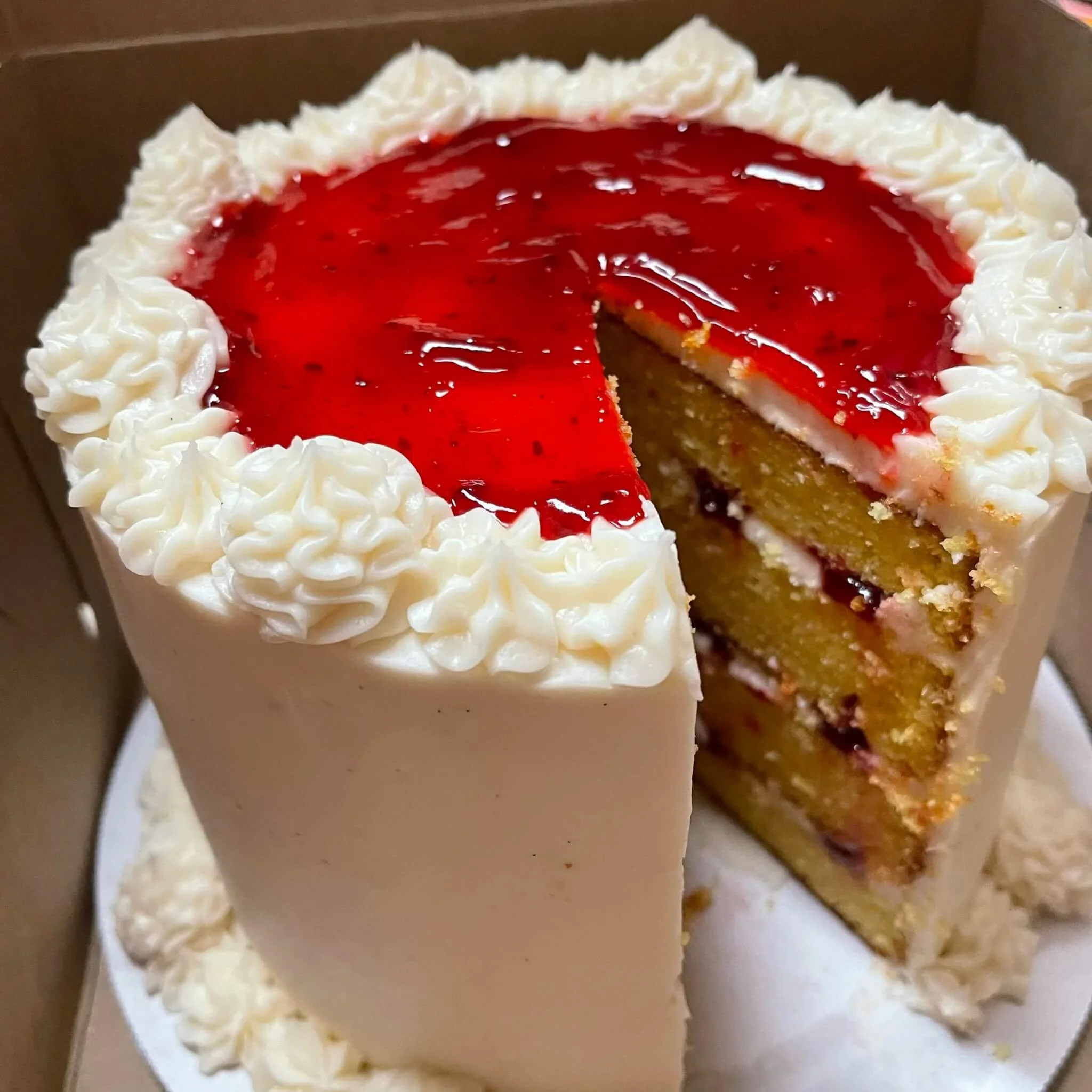 lemon cake with strawberry filling and vanilla buttercream.jpg