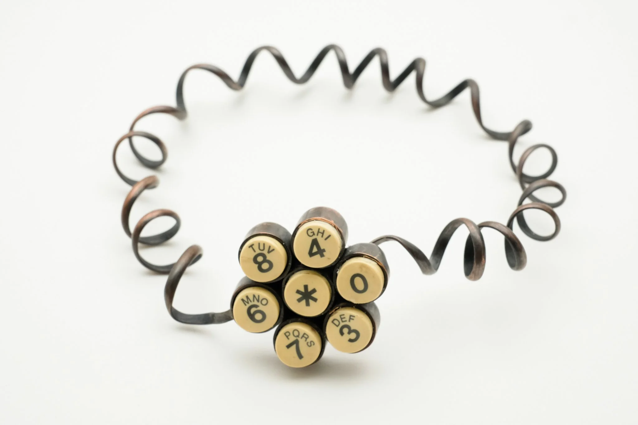 'Dialing You' telephone piece necklace. Capturing the nostalgic dialling motion of the telephone, an action now obsolete yet still remembered, this piece repurposes the object for the body, allowing its memory to linger through wear.
Materials: Coppe