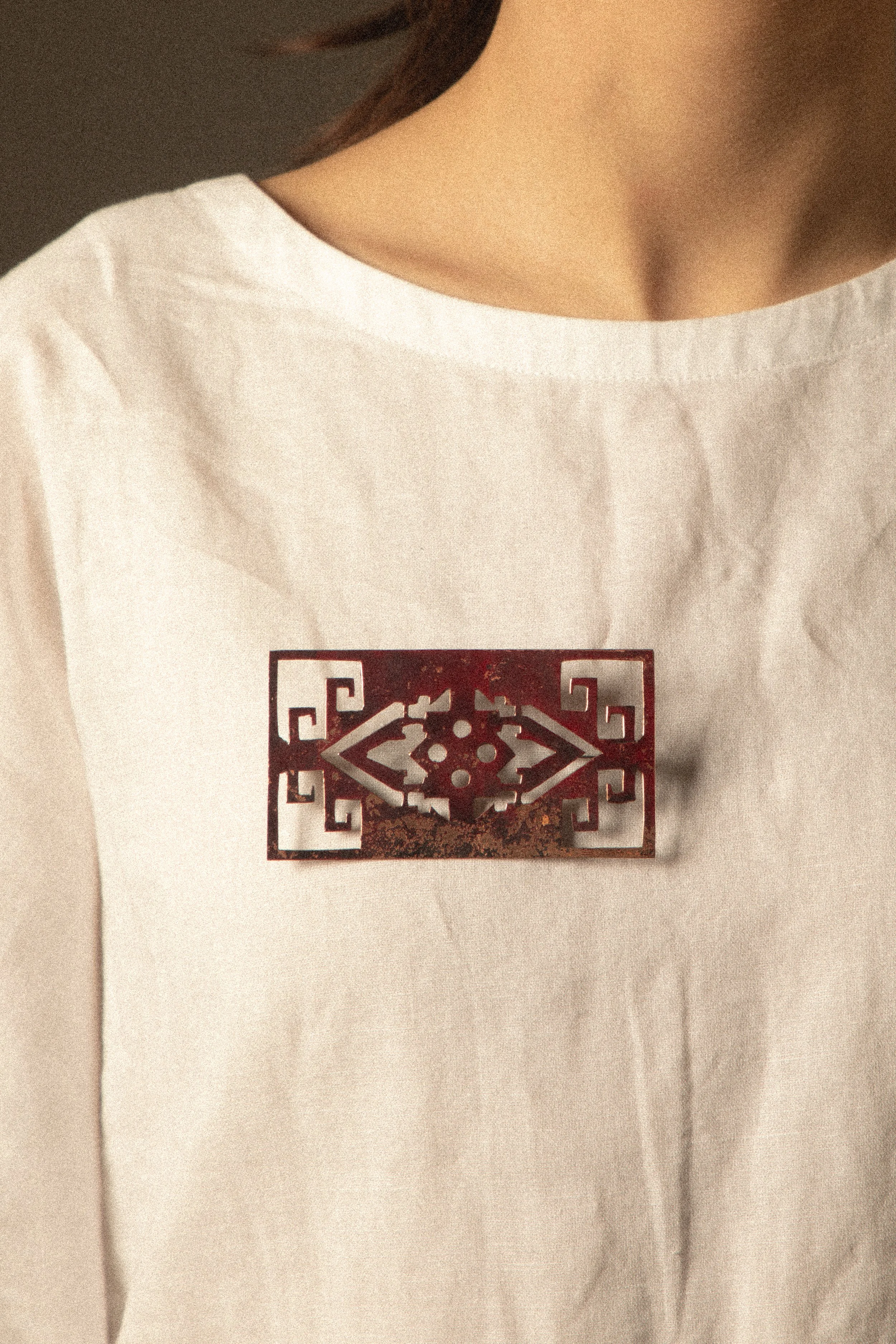 Preservation Brooch.

Preservation captures the essence of a worn-out carpet—its shine faded through time and use, yet its symbolic beauty and meaning remain, now carried on the body.

Materials: Copper, steel, brass