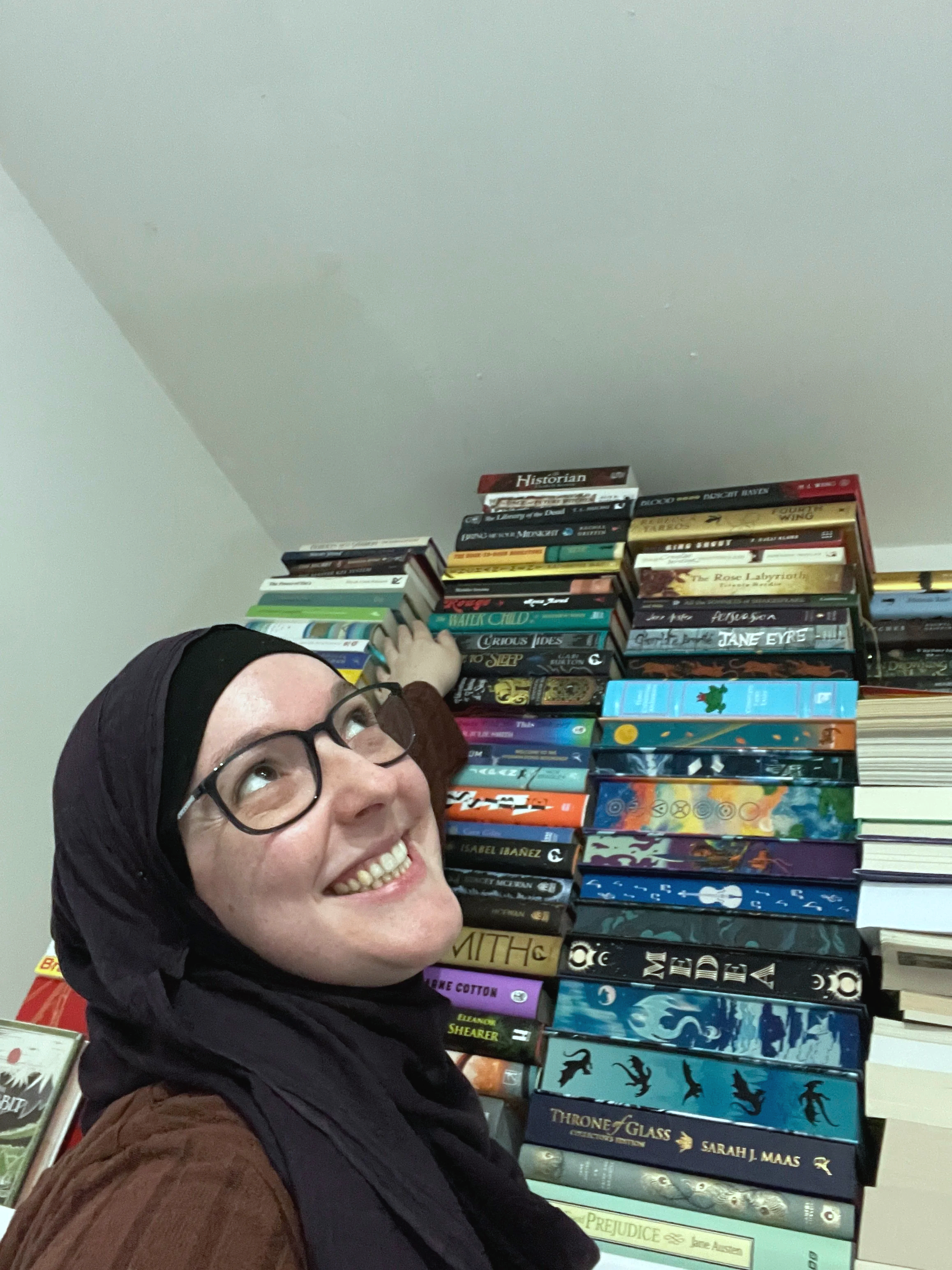 happy smiling and stroking my books