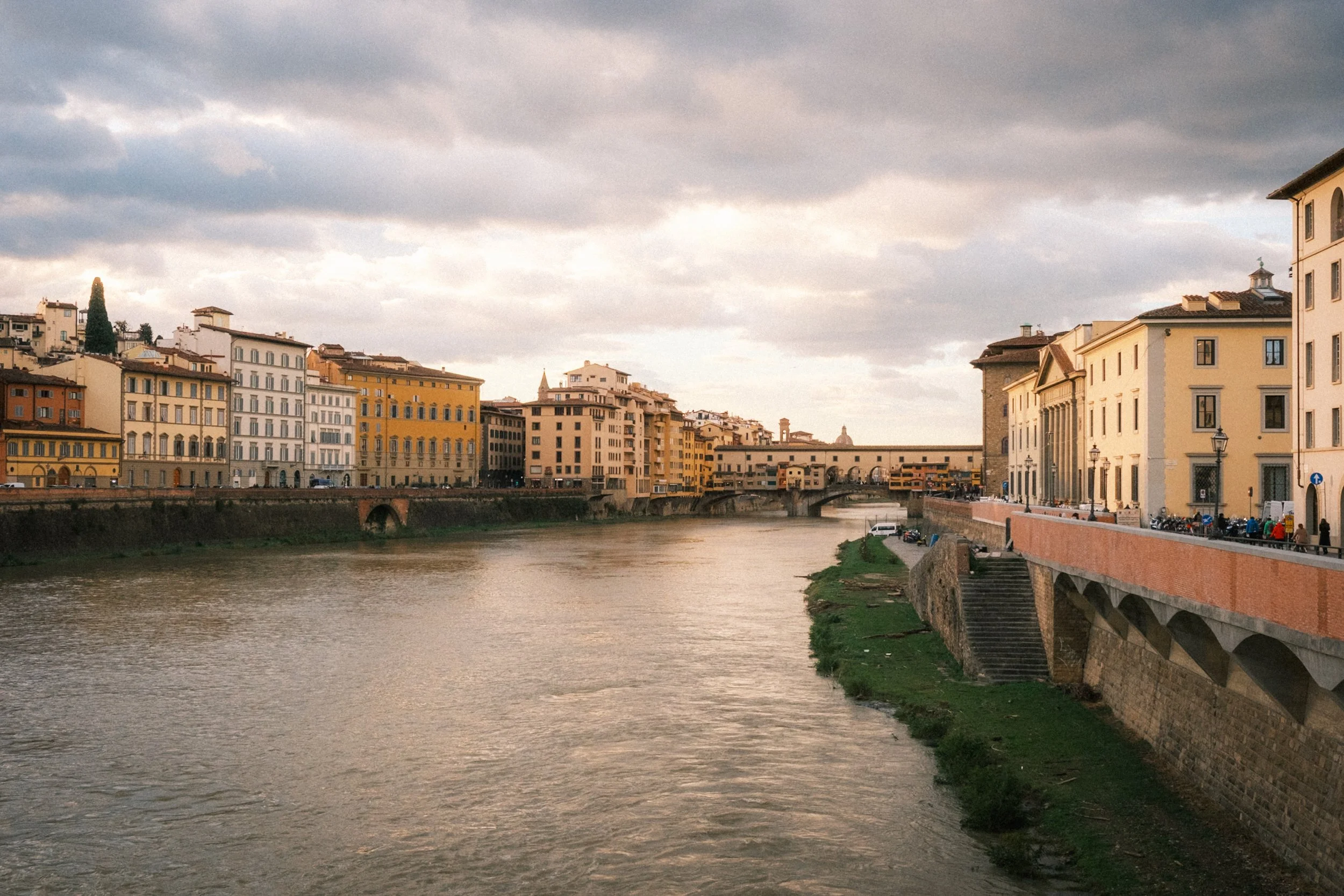 View along the Arno River through the historic centre of Florence, Italy