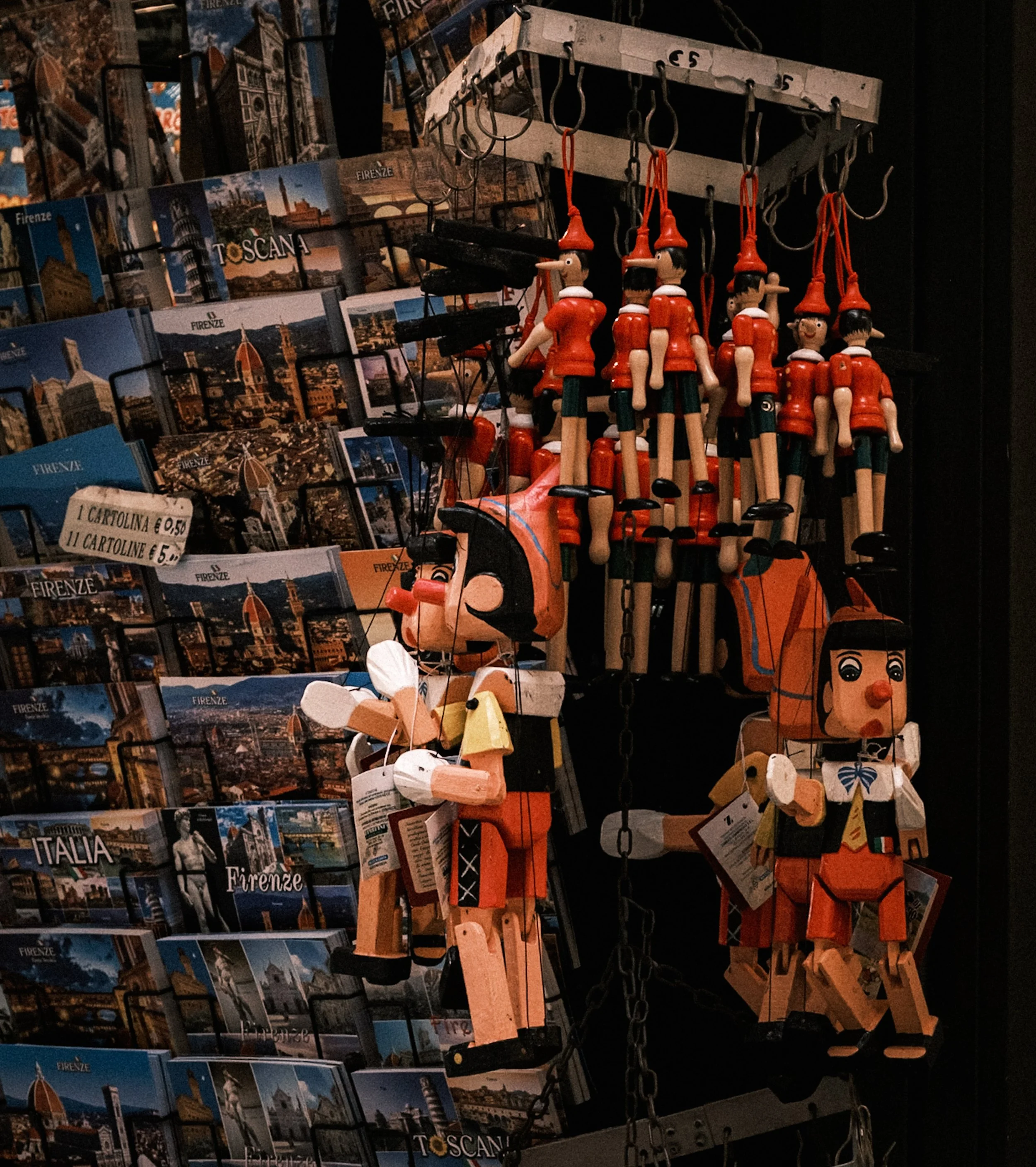 Traditional Pinocchio wooden souvenirs and Florence postcards at a local shop
