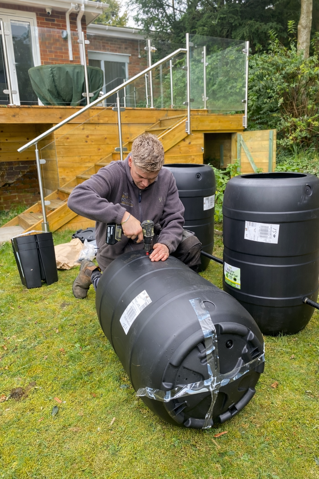 Design and build landscaper installing a rainwater harvesting system as part of a garden landscaping project in North London.