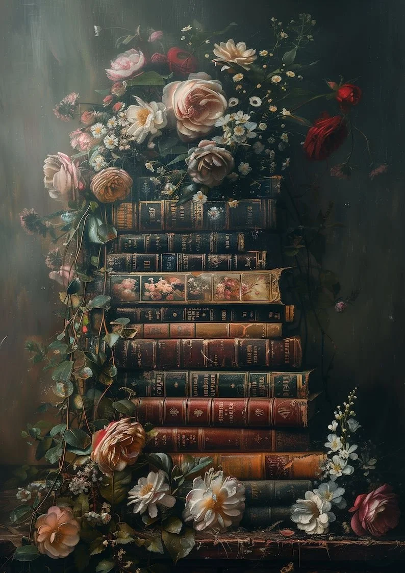 Stack of old, worn books surrounded by pink, red, and white flowers with green leaves.