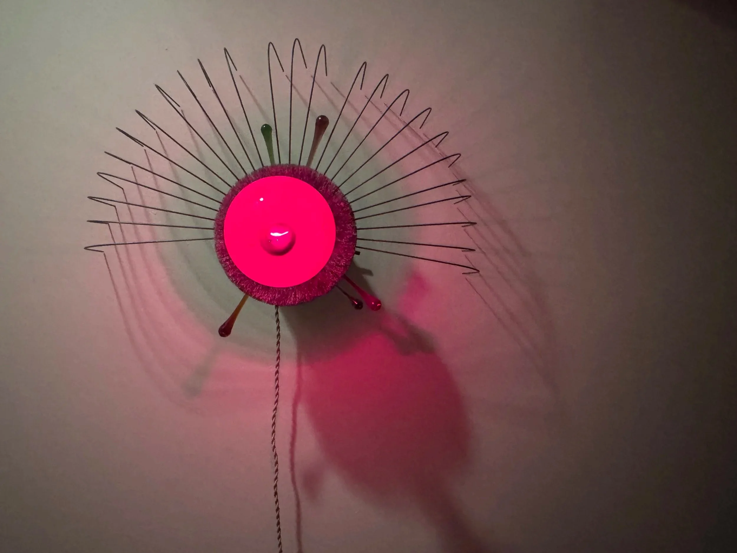       
  
     SET NINE  wall based sculpture (in development)  Deconstructed George Nelson saucer bubble pendant lamp, 8” coarse steel wire wheel, jumbo safelight bulb, silicone grip nuts, ivory twisted rayon cord, porcelain socket, antique long nec