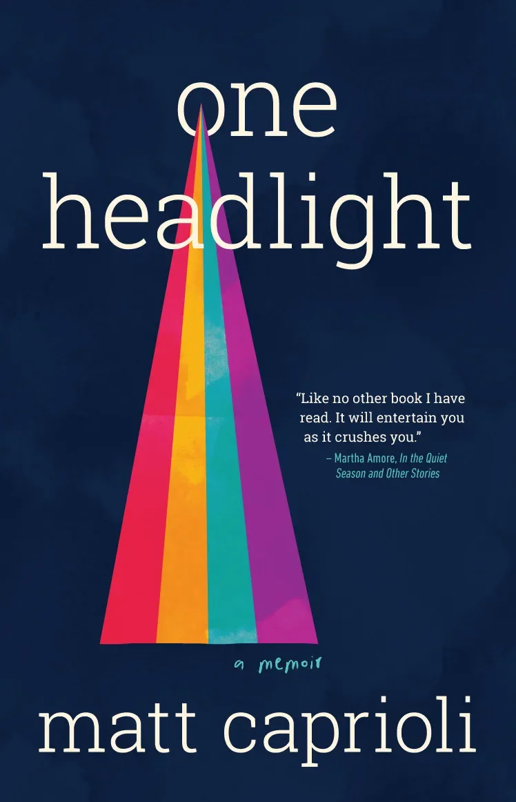 Book cover for "One Headlight" by Matt Caprioli, featuring a dark blue background, a colorful triangular shape resembling a rainbow, and white text with a quote from Martha Amore.