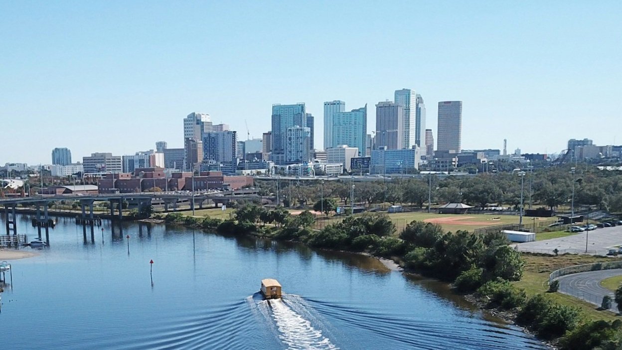 Downtown skyline along the Riverwalk in Tampa showcasing real estate market opportunities