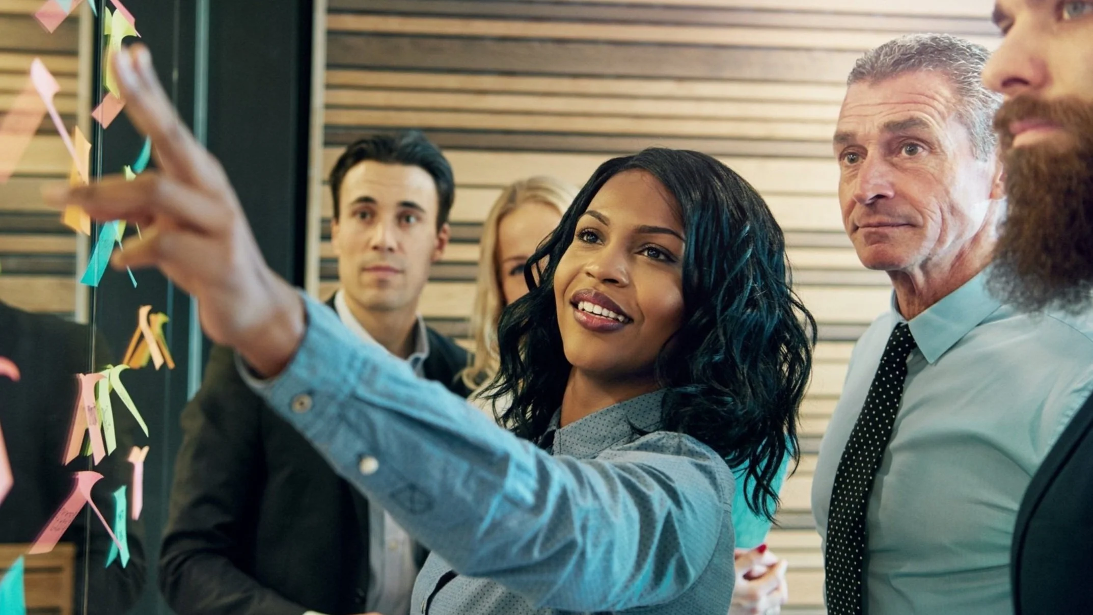 Realtor® reviewing custom real estate marketing program materials including digital and print campaigns