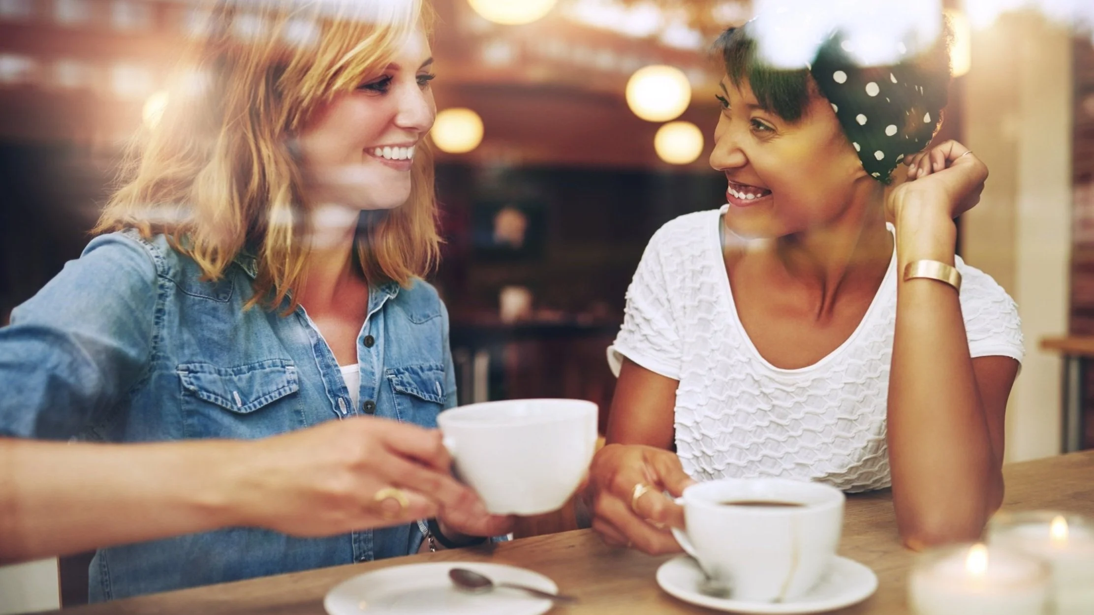 Real estate agent having coffee with a potential client
