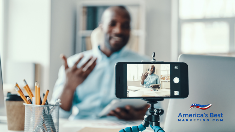Realtor filming an Instagram Reel listing walkthrough on a phone tripod in a home office