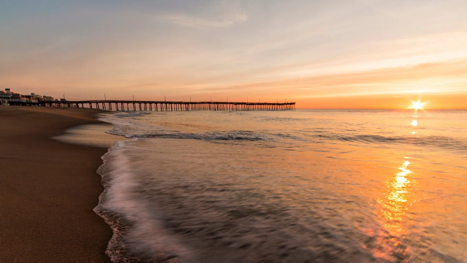 Oceanfront boardwalk in Virginia Beach showcasing real estate market opportunities