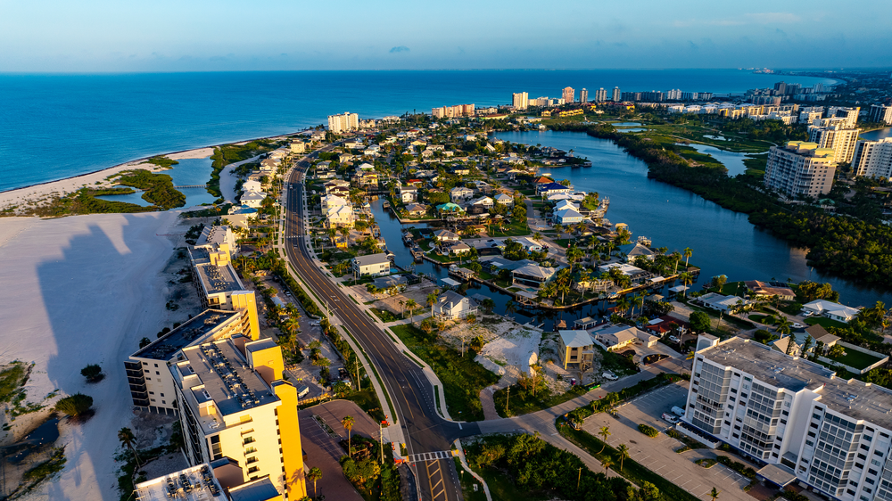 Fort Myers Beach skyline and Gulf Coast real estate marketing context for Fort Myers agents