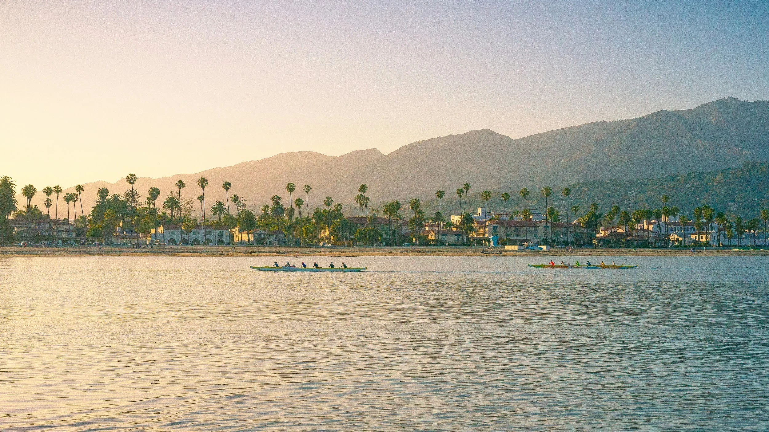 Harbor, shoreline, and Riviera hillside in Santa Barbara showcasing real estate market opportunities