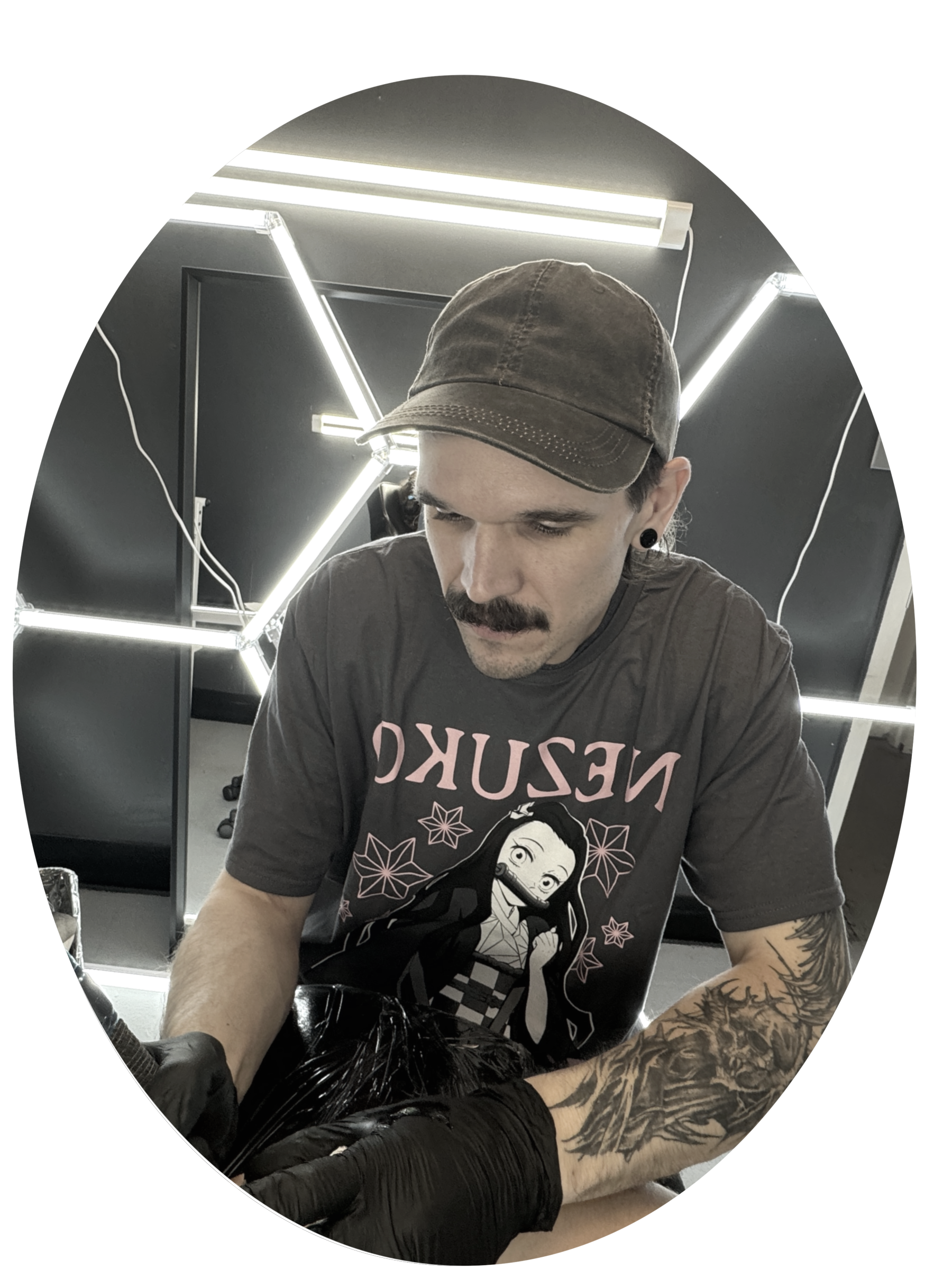 An image of the tattoo artist, Jesse, working on a project. All of his attention is focussed on the details necessary to create an amazing and lasting tattoo.