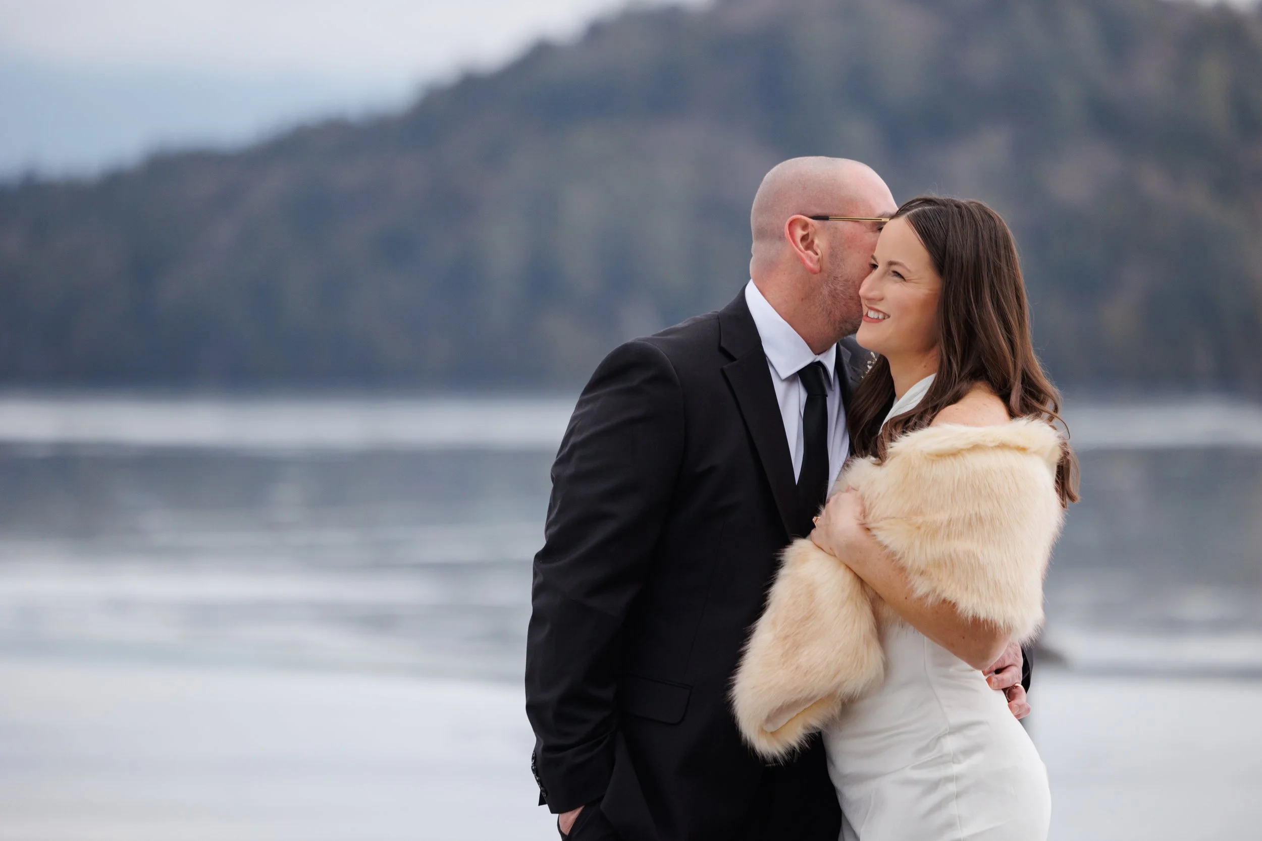 Candid moment of bride and groom laughing during Lake Placid Lodge elopement