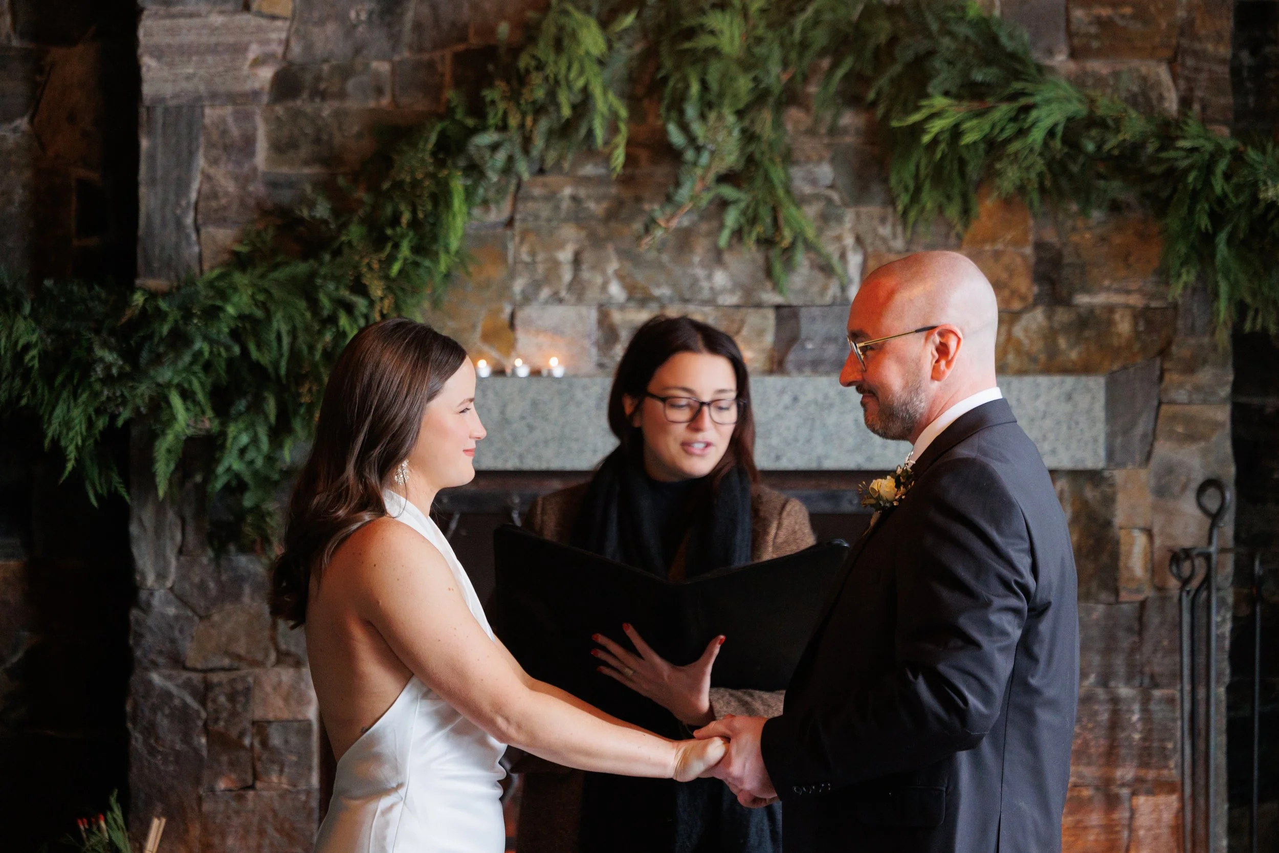 Outdoor winter elopement ceremony by the fire at Lake Placid Lodge in February