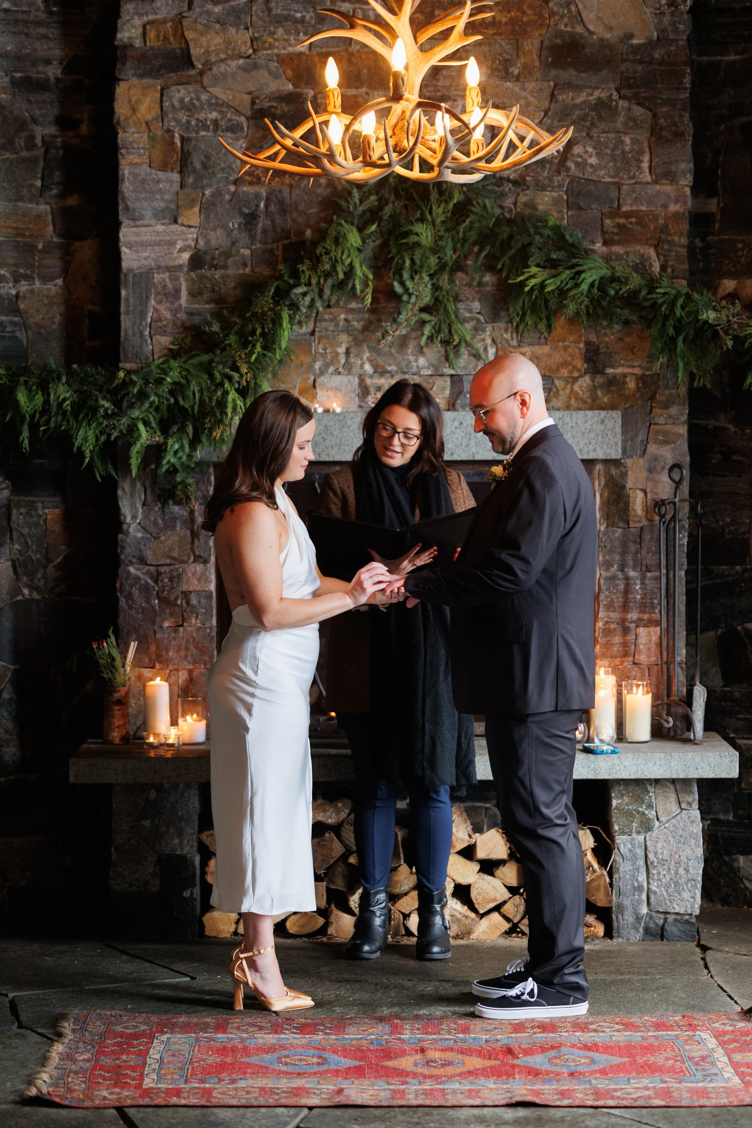 Outdoor winter elopement ceremony by the fire at Lake Placid Lodge in February