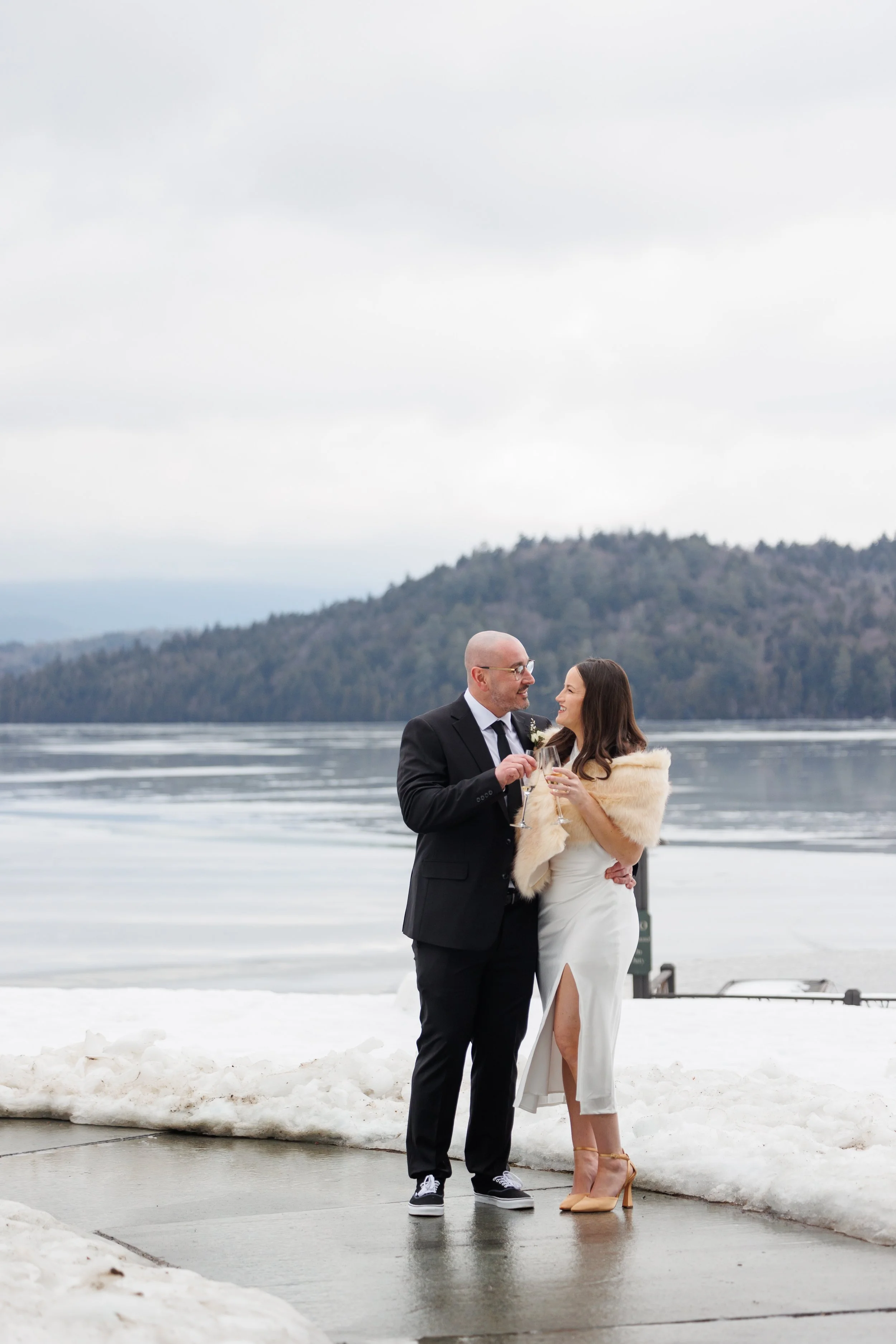 Candid moment of bride and groom laughing during Lake Placid Lodge elopement