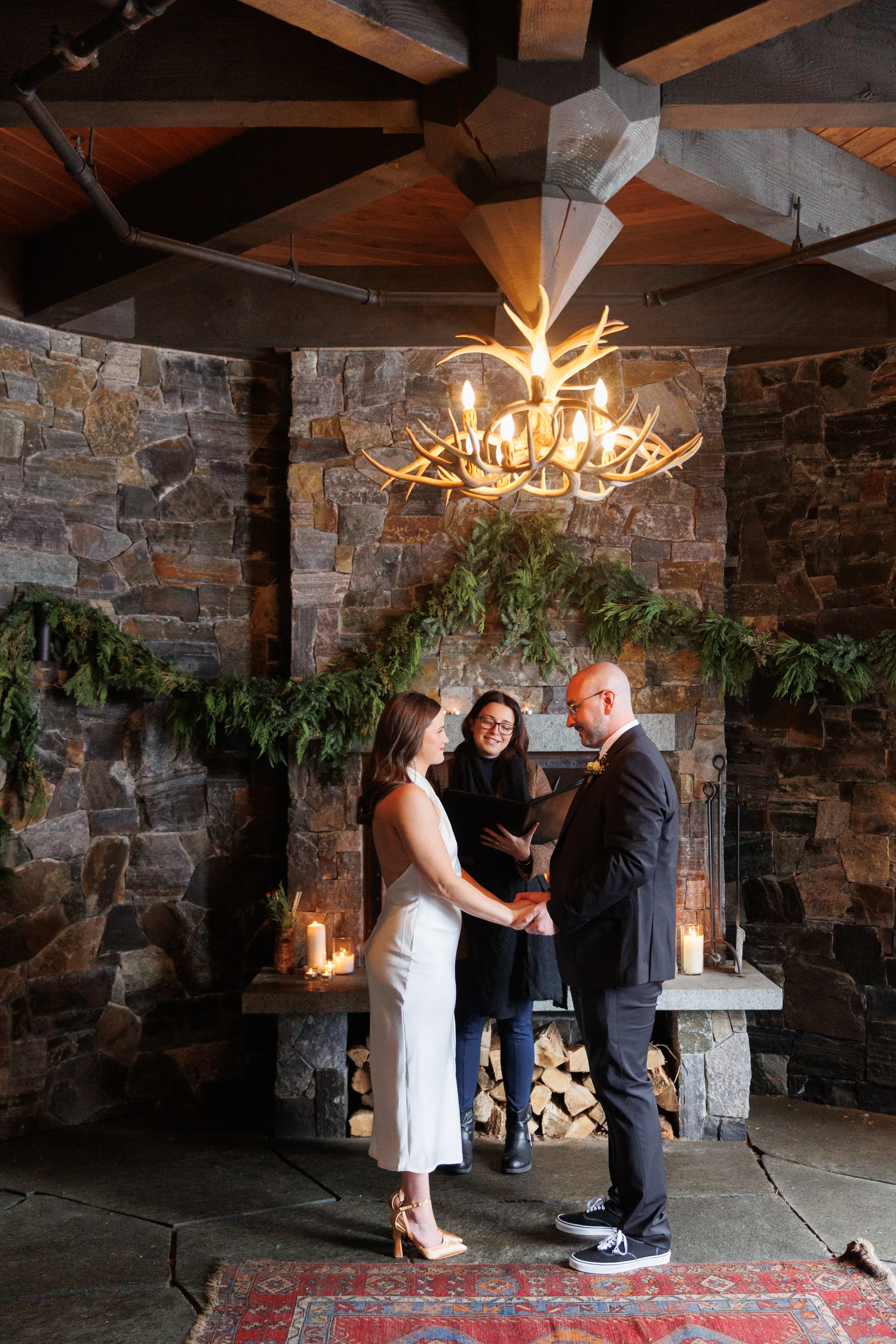 Outdoor winter elopement ceremony by the fire at Lake Placid Lodge in February